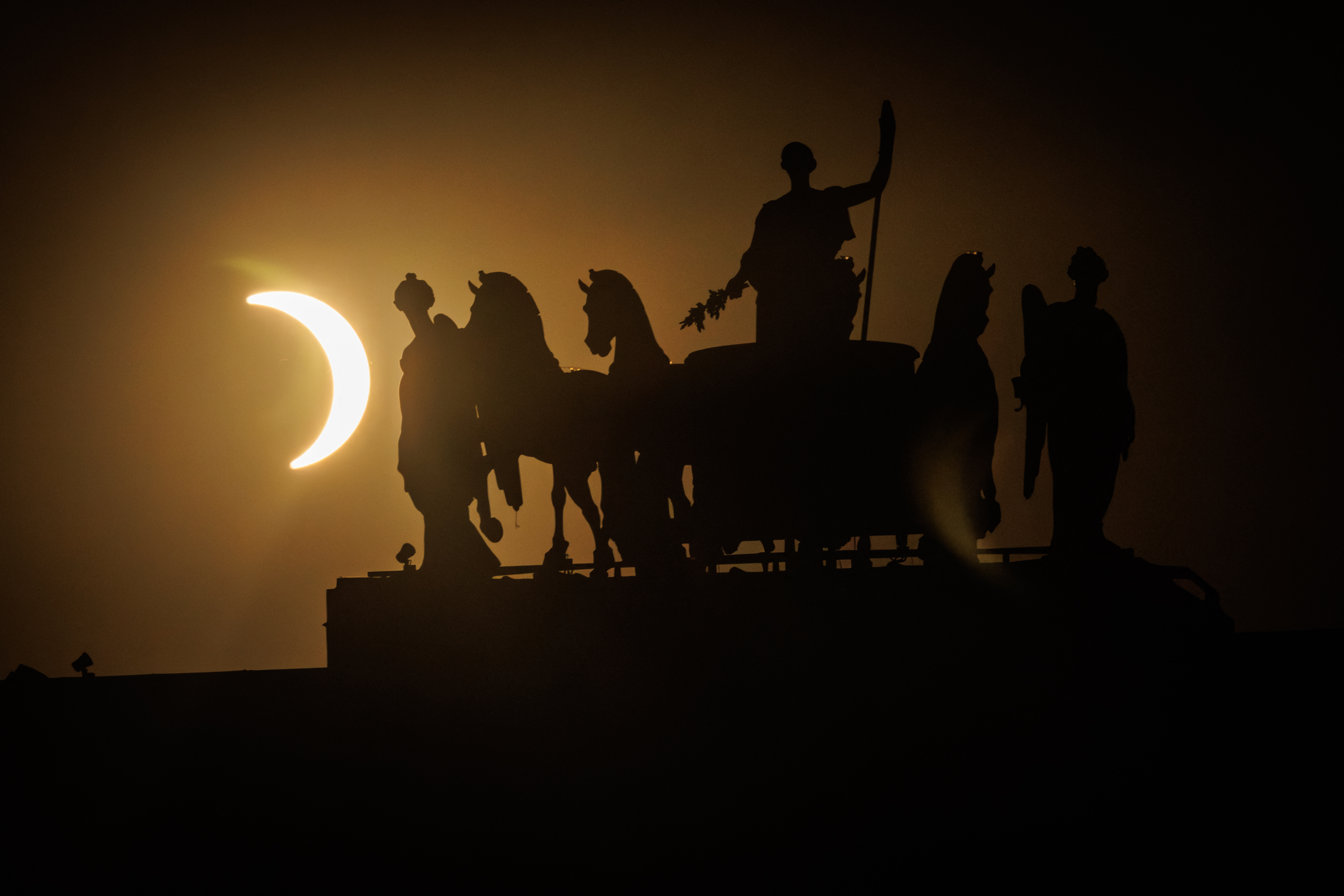 Solar eclipse plunges parts of Europe into darkness