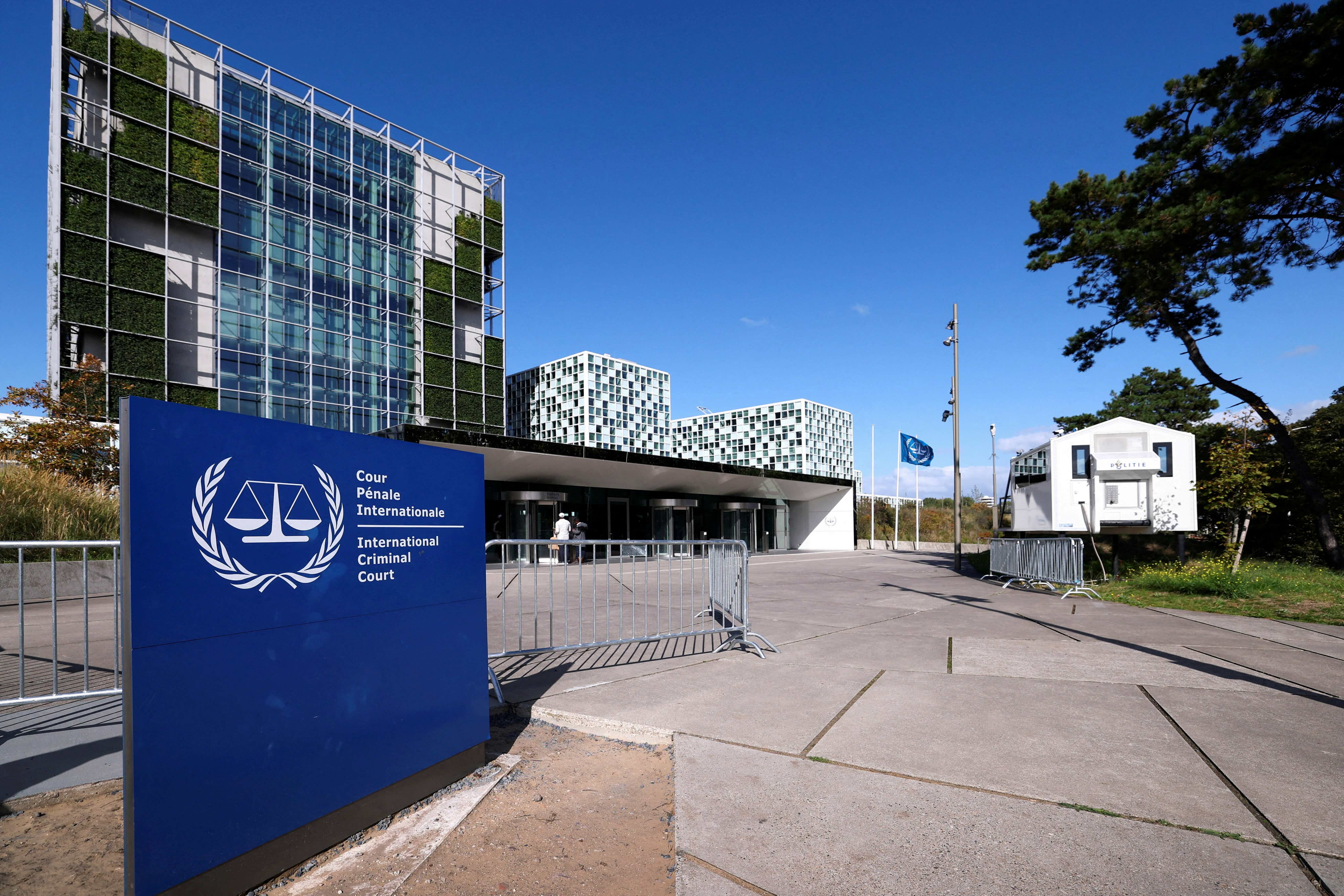 FILE PHOTO: People stand outside the International Criminal Court in the Hague, Netherlands, September 22, 2025. REUTERS/Piroschka van de Wouw/File Photo