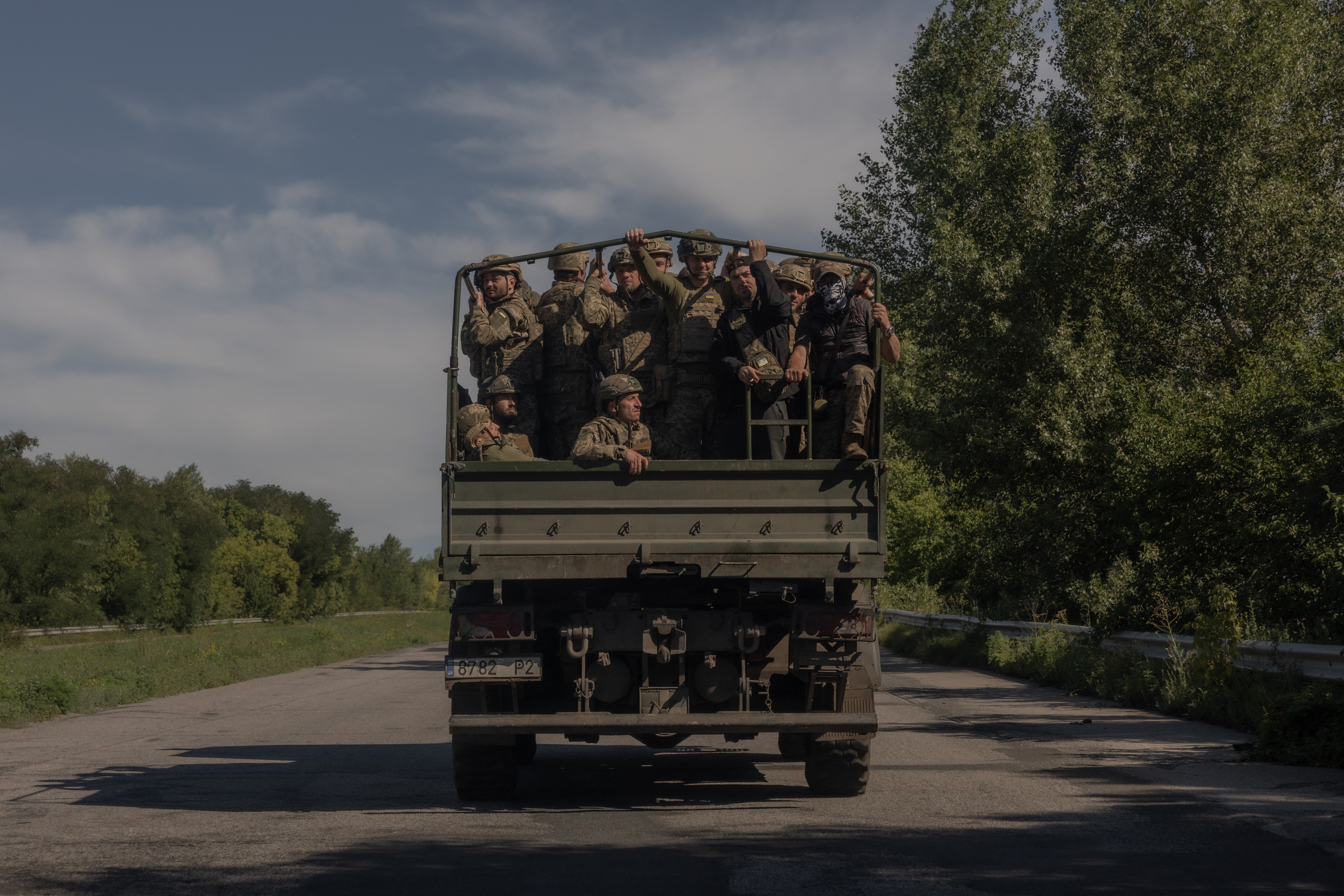 Ukrainian soldiers drive in a military truck along a road in the Kharkiv region on July 30, 2026, amid the Russian invasion of Ukraine.