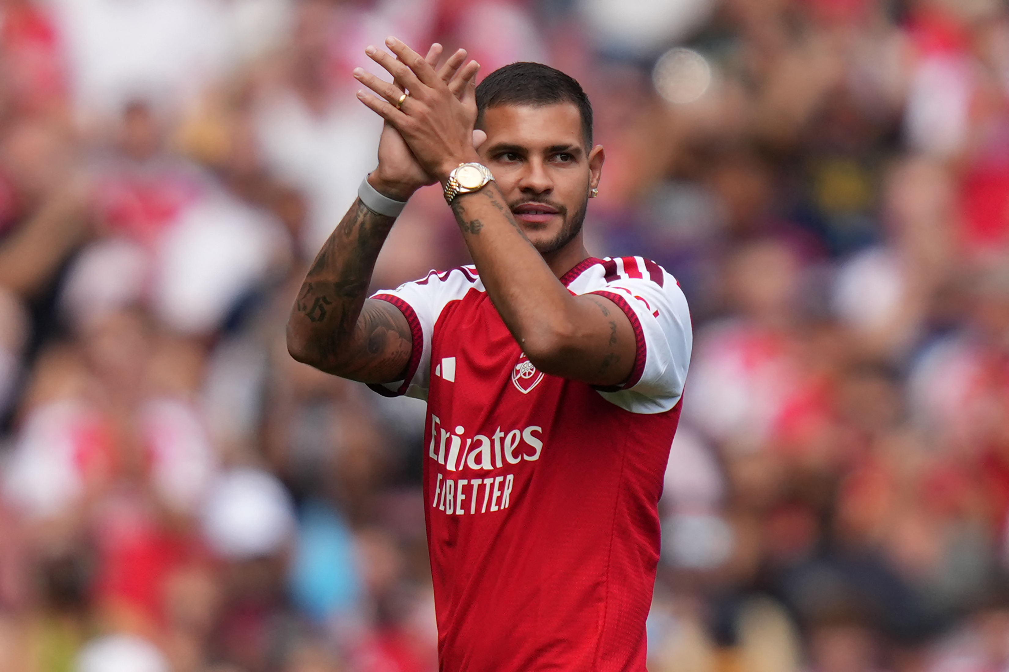 Arsenal's Brazilian midfielder #39 Bruno Guimarães applauds as he is introduced to the fans ahead of the pre-season friendly football match between Arsenal and Borussia Dortmund at the Emirates Stadium in London on August 9, 2026.