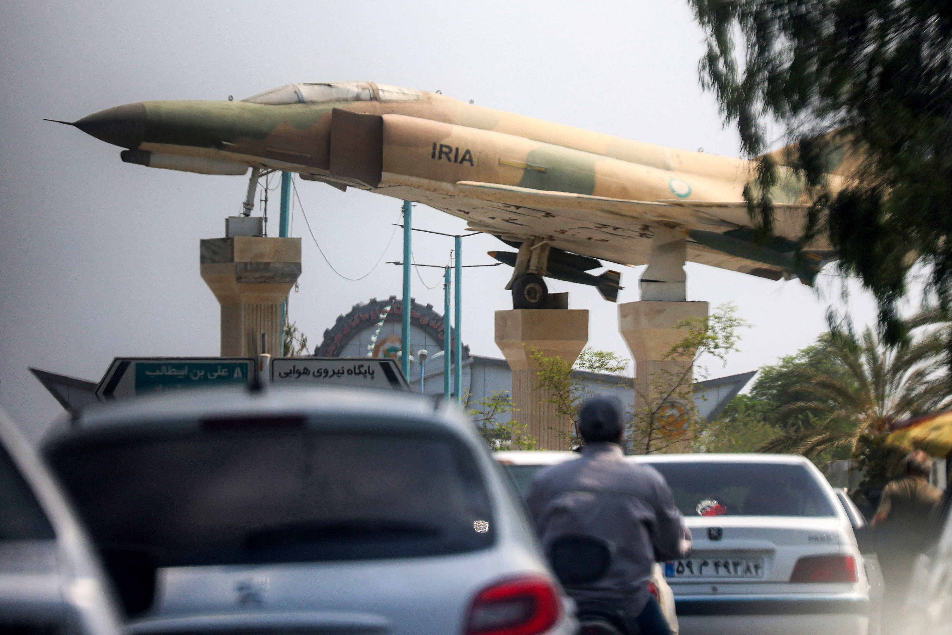 A replica of an Iranian air force F-4 Phantom fighter aircraft is displayed before traffic along a city square in Bandar Abbas in southern Iran on August 10, 2026.