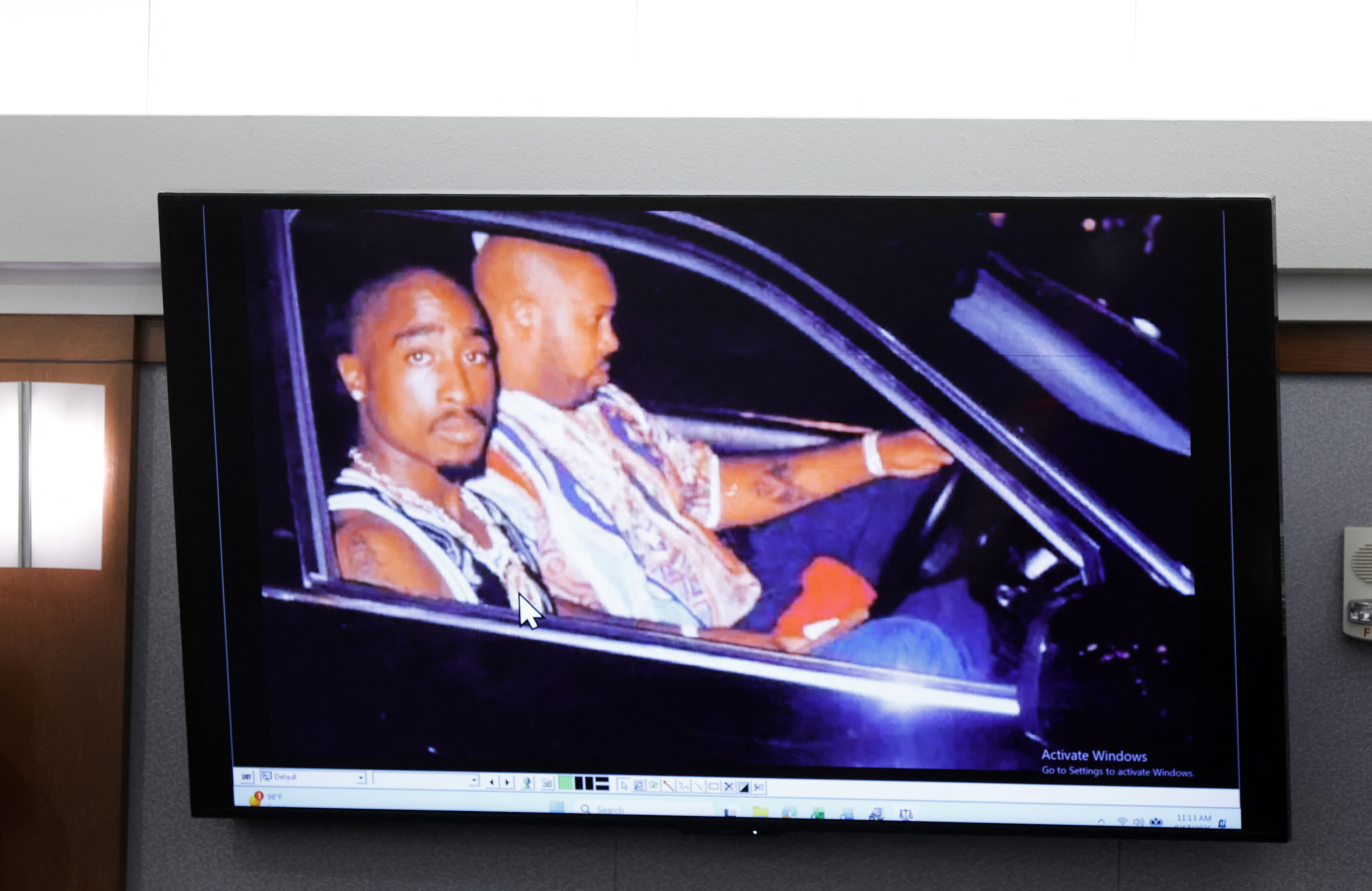 A 1996 photo of rapper Tupac Shakur (L) and Marion “Suge” Knight is displayed during the Duane Davis murder trial, related to the 1996 killing of the rapper, at Clark County District Court at the Regional Justice Center in Las Vegas, Nevada, on August 17, 2026.