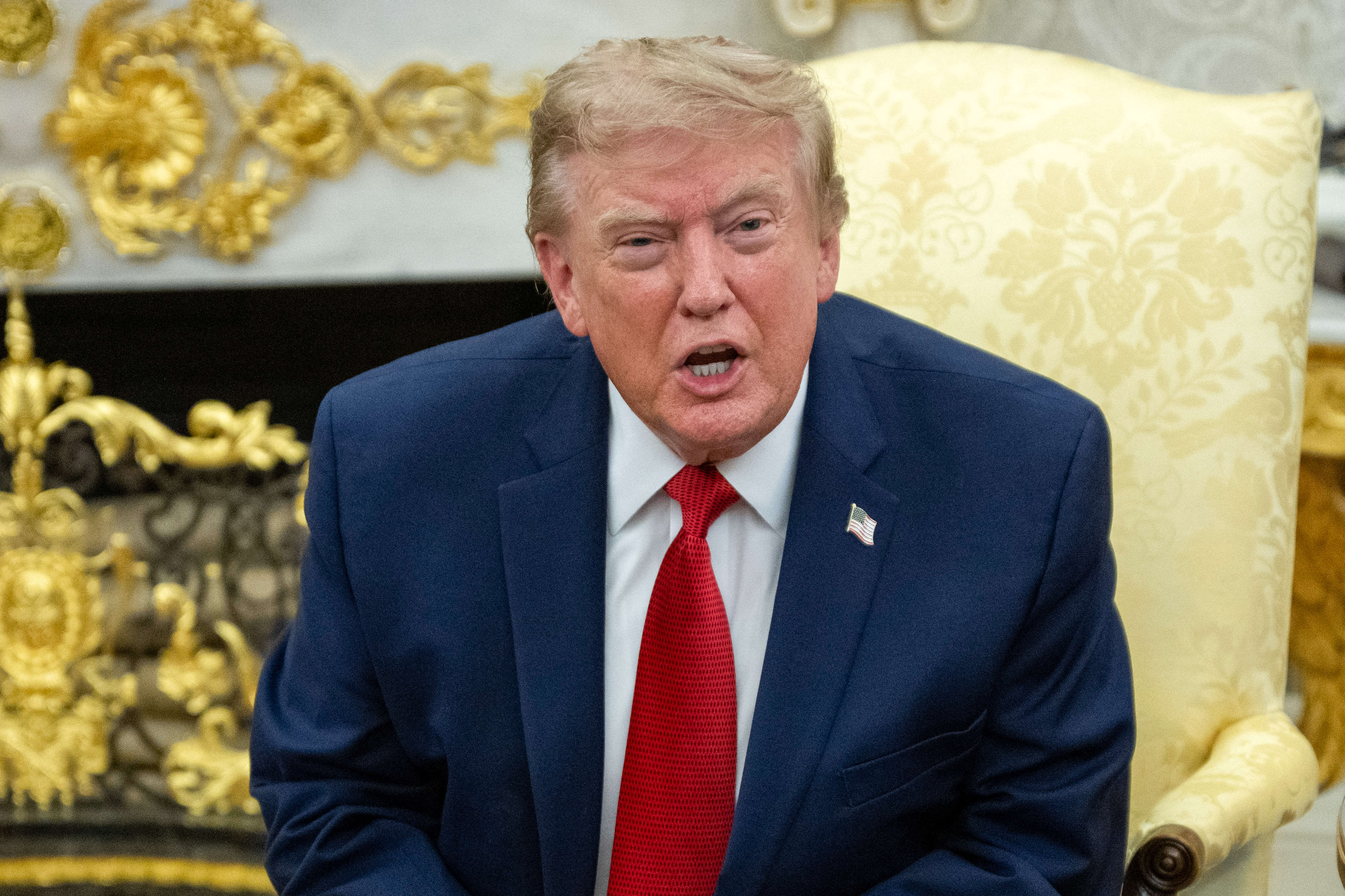 US President Donald Trump speaks as he meets with lifeguard Ryder Williams in the Oval Office of the White House in Washington, DC, on August 17, 2026.
