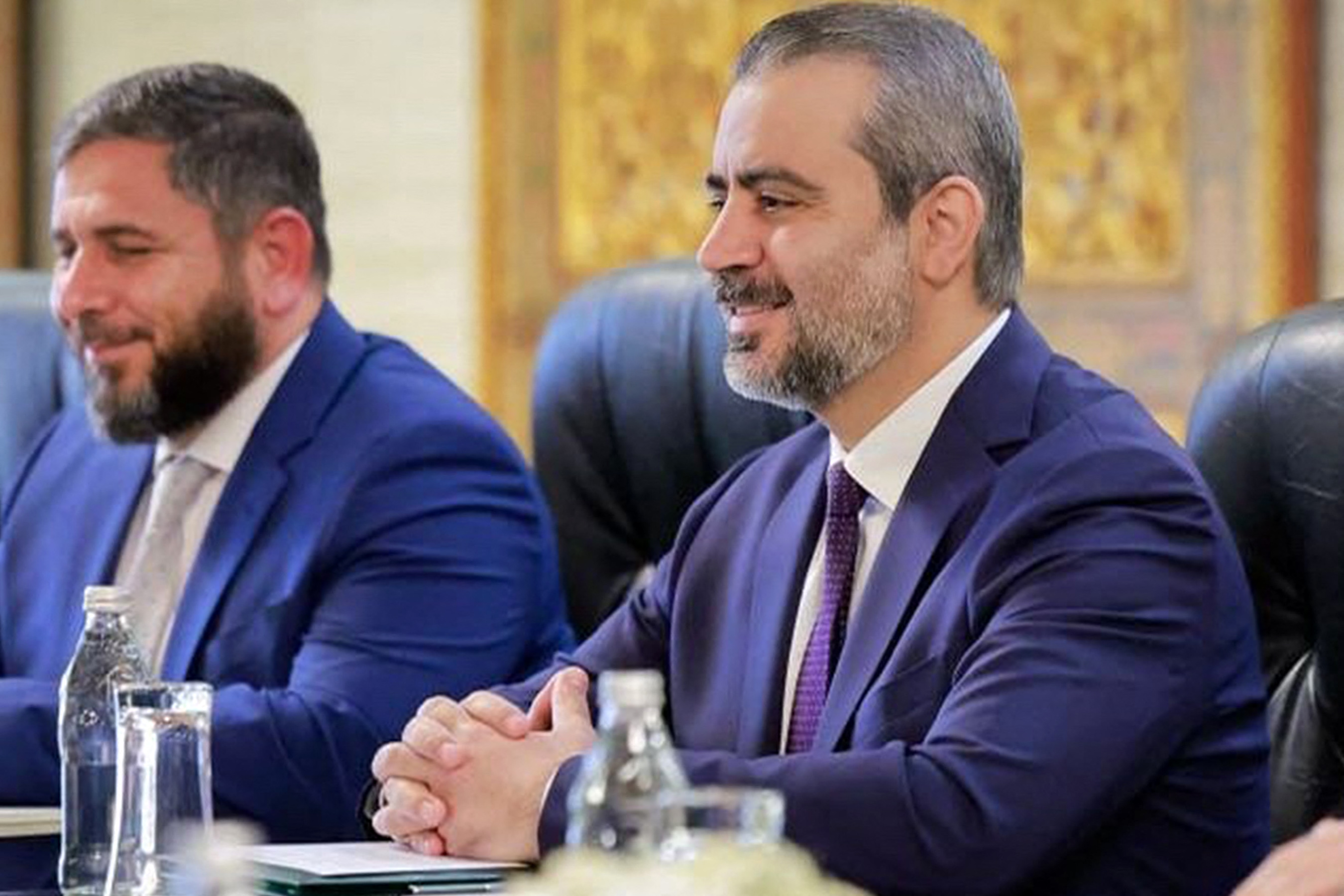This handout picture released by the official Syrian Arab News Agency (SANA) shows Syria's interim foreign minister Asaad Shaibani (C) meeting with the International Atomic Energy Agency (IAEA) director general in Damascus on August 18, 2026.