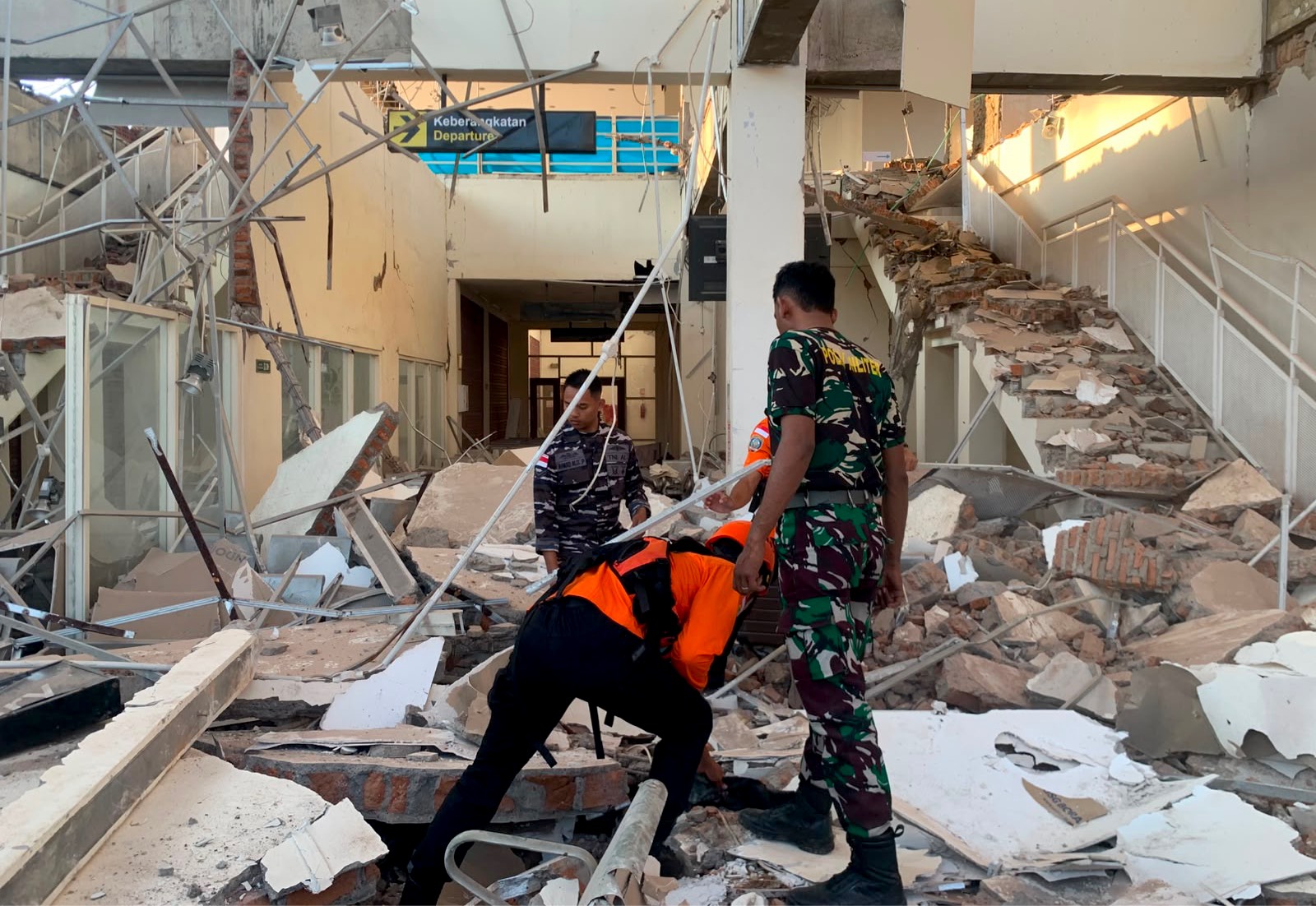 Rescuers search for victims in Maumere, Indonesia