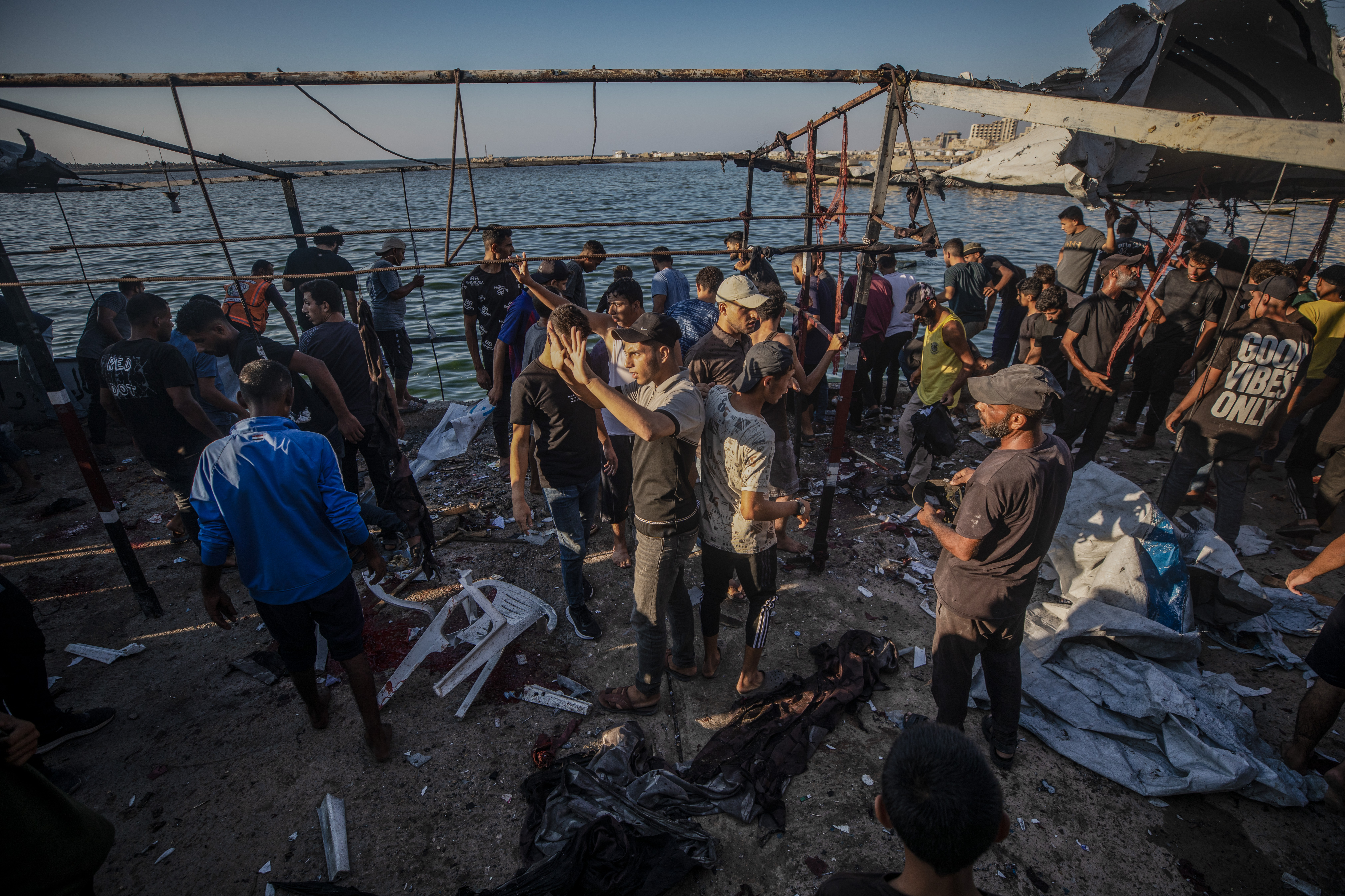 epa13177631 Palestinians inspect a cafe destroyed in an Israeli airstrike at Gaza port near the beach in Gaza City, 18 August 2026. The Ministry of Health in Gaza said at least six Palestinians were killed and others injured in an Israeli airstrike in western Gaza City. EPA/MOHAMMED SABER