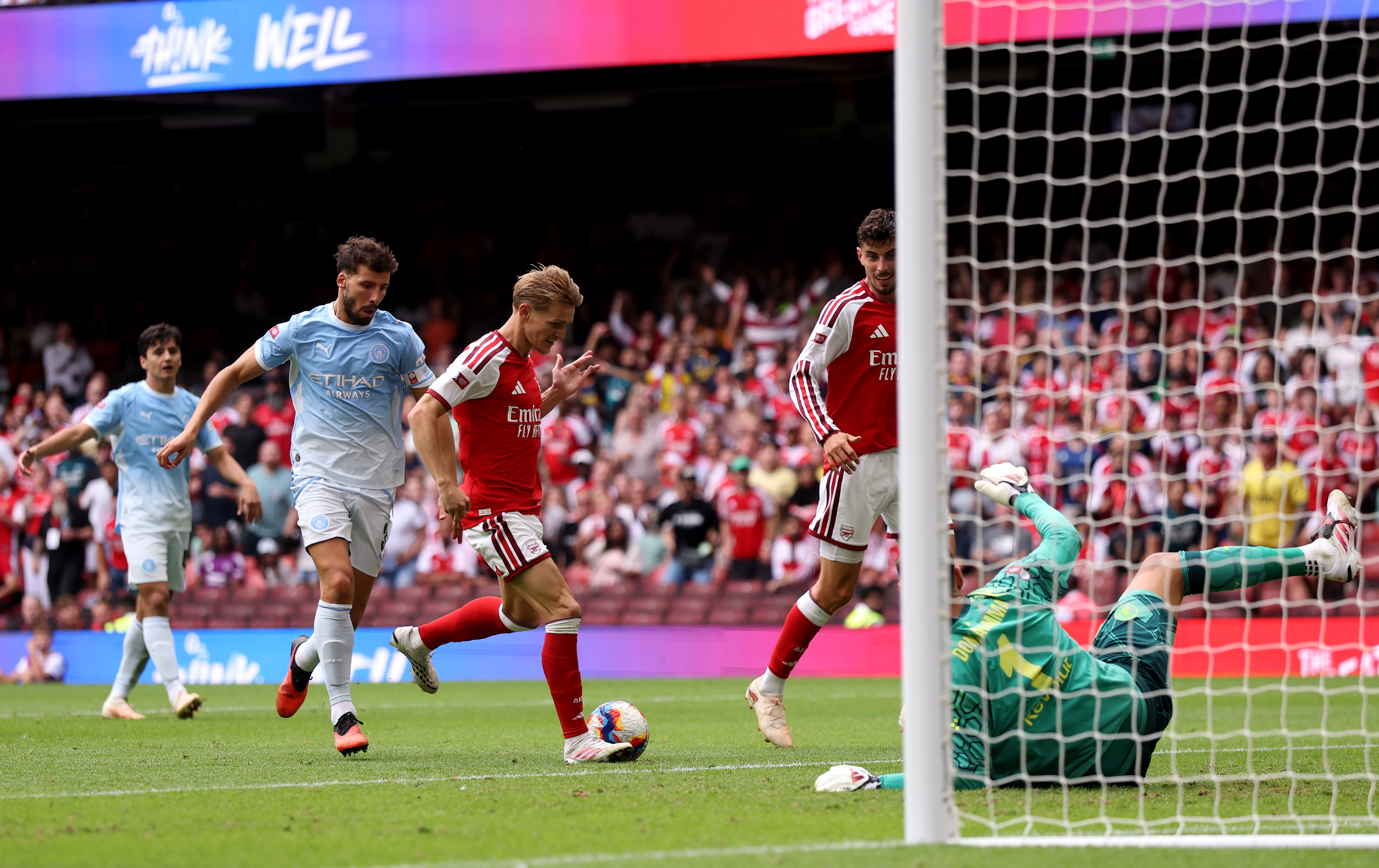 CARDIFF, WALES - AUGUST 16: Martin Odegaard of Arsenal scores his team's third goal during the 2026 FA Community Shield match between Arsenal and Manchester City at Principality Stadium on August 16, 2026 in Cardiff, Wales. (Photo by Carl Recine/Getty Images)