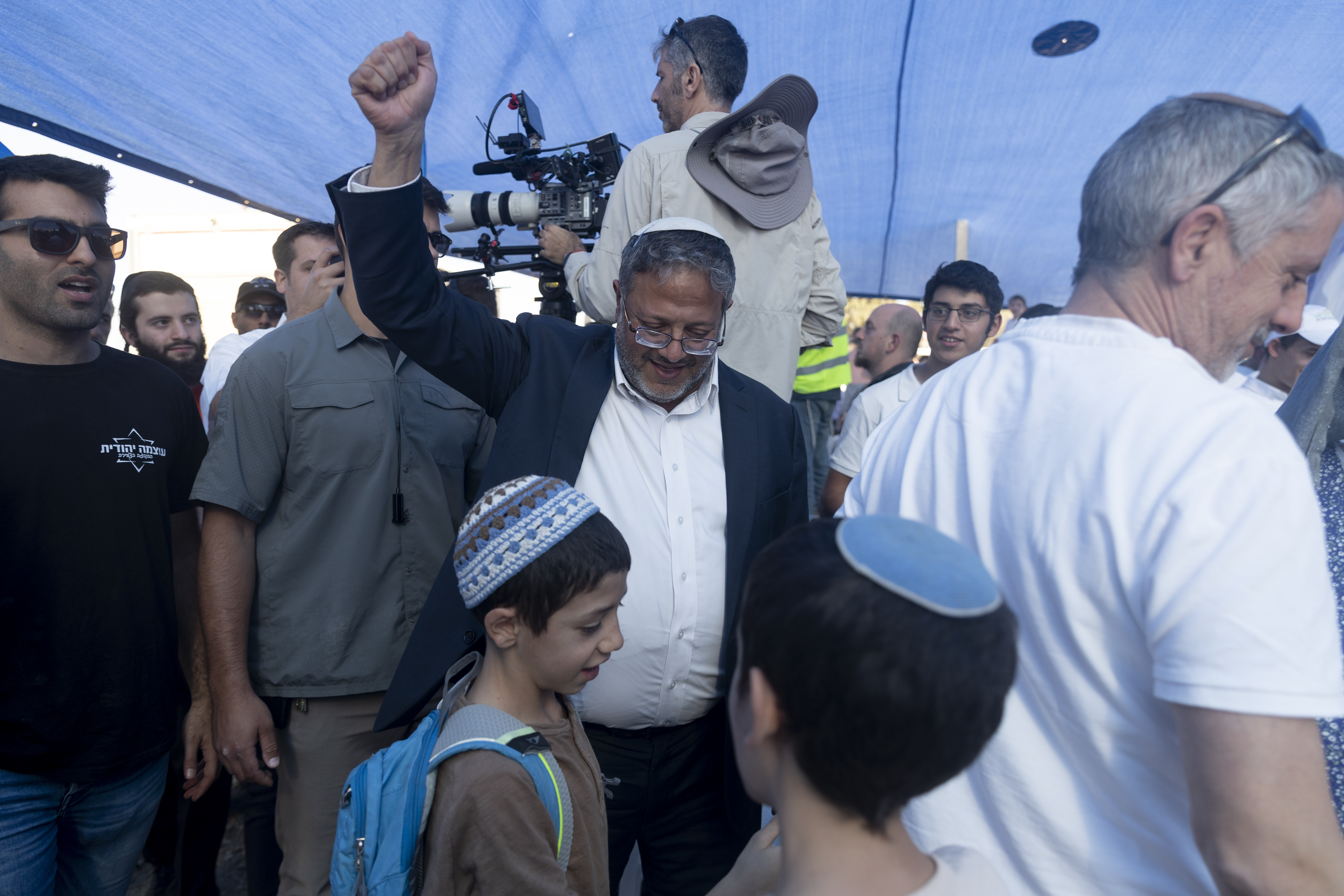 SOUTHERN BORDER, ISRAEL - OCTOBER 21: Israeli National Security Minister Itamar Ben Gvir (C) attends a Sukkoth gathering calling for resettling Gaza with Jewish communities near the border with the Gaza Strip on October 21, 2024 in Southern Border, Israel. Far-right activists and members of the Israeli Parliament, the Knesset, are gathering at an event billed as "Preparing to Resettle Gaza," near Israel's border with Gaza, on Monday. Participants in the conference are calling for the rebuilding of Jewish Israeli settlements in the Gaza Strip. (Photo by Amir Levy/Getty Images)