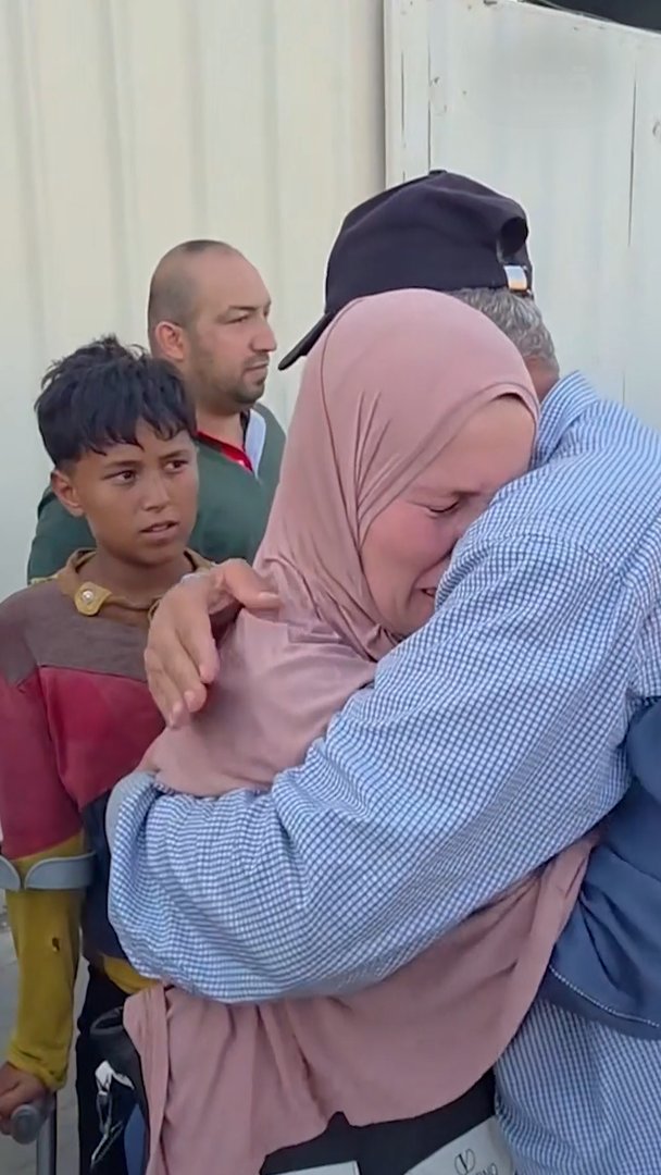 Released Palestinian prisoner embraces his loved one after returning to Gaza. August 16, 2026, Khan Younis, Gaza [Screenshot via Al Quds News Network video on Telegram]