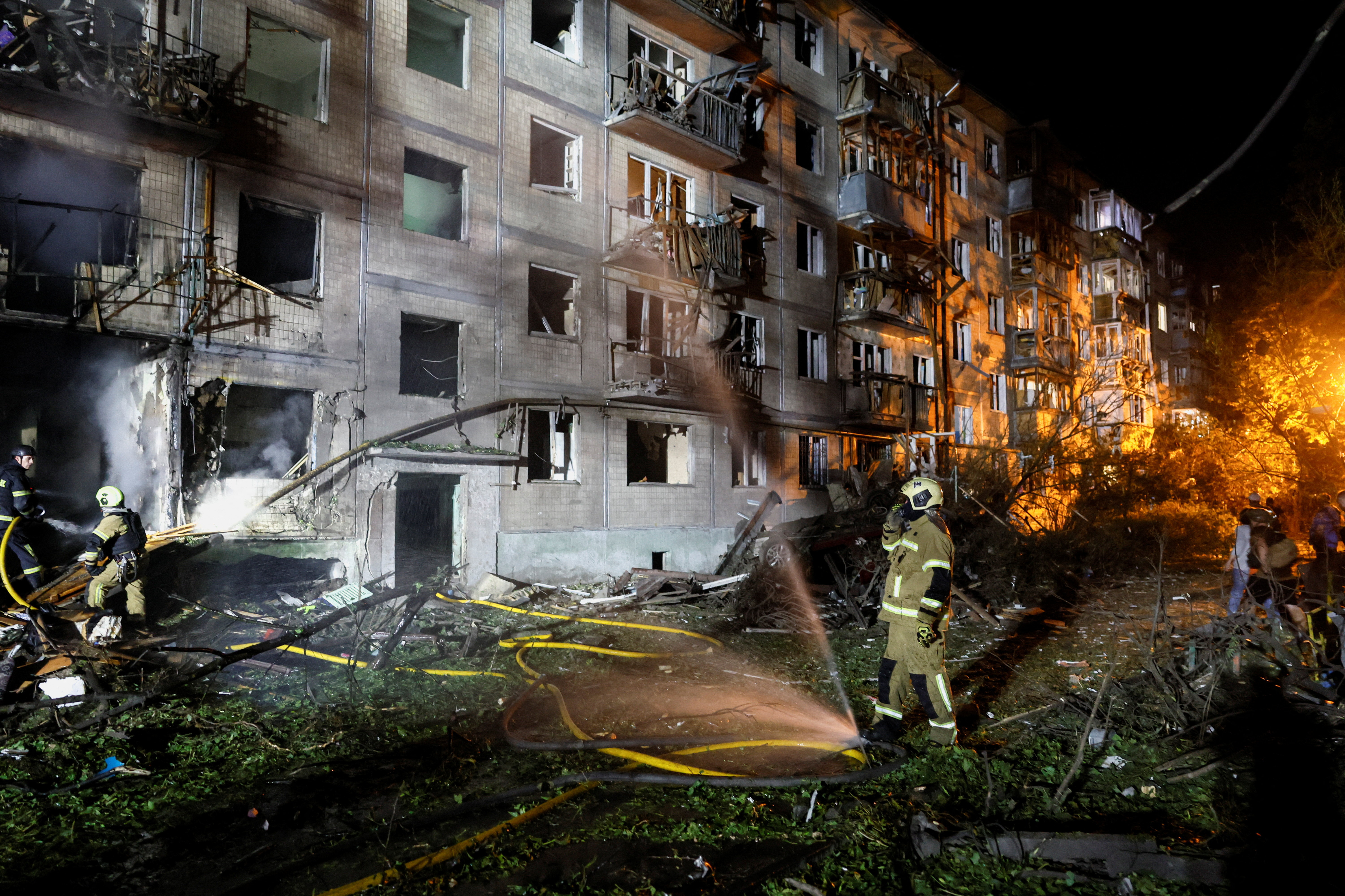 Firefighters work at the site of an apartment building hit by a Russian missile strike, amid Russia's attack on Ukraine, in Kyiv, Ukraine, August 1, 2026. REUTERS/Gleb Garanich