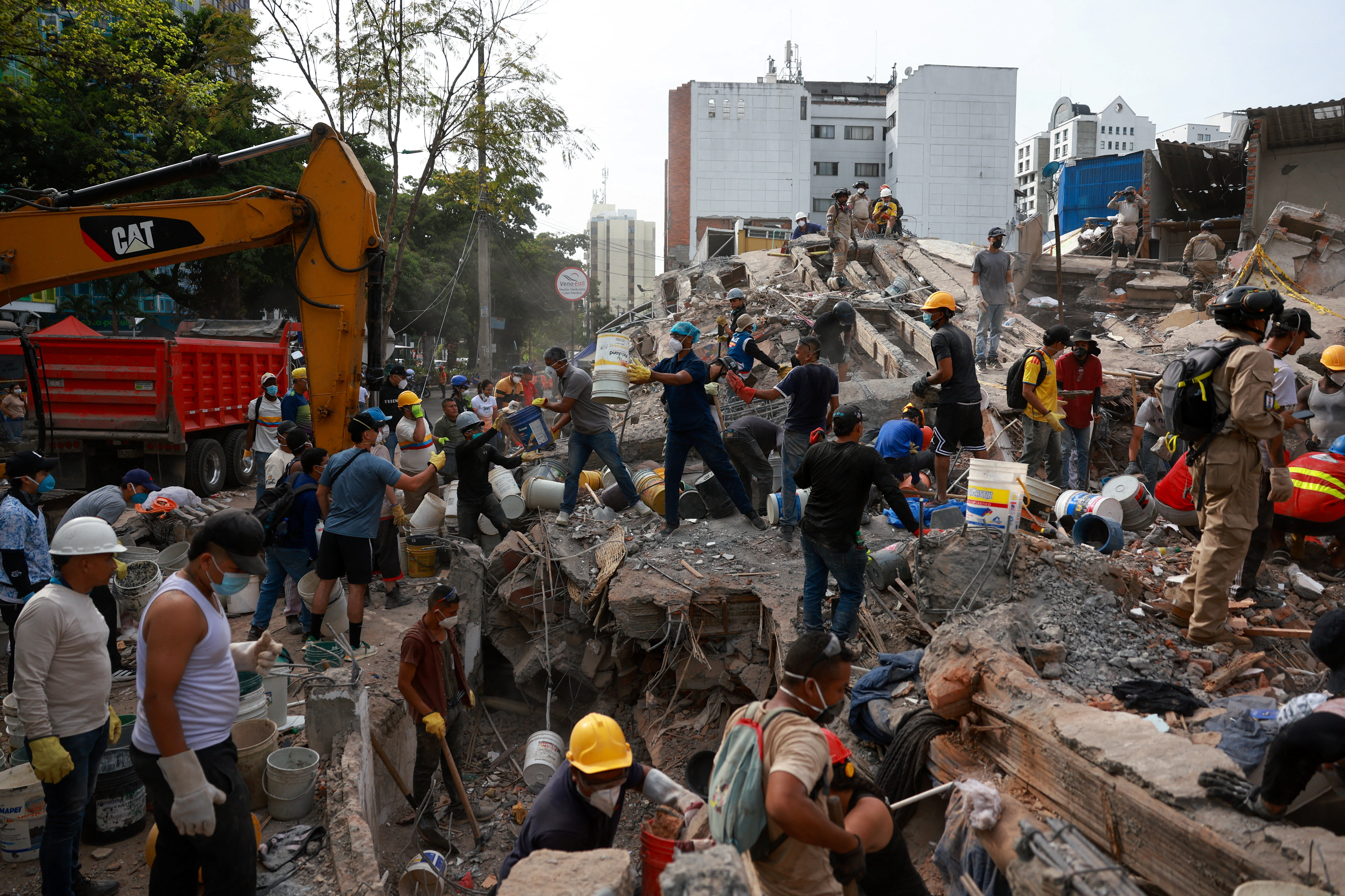 Rescuers search for survivors amid destroyed buildings following an earthquake, in Cali, Colombia, August 12, 2026. REUTERS/Raquel Cunha