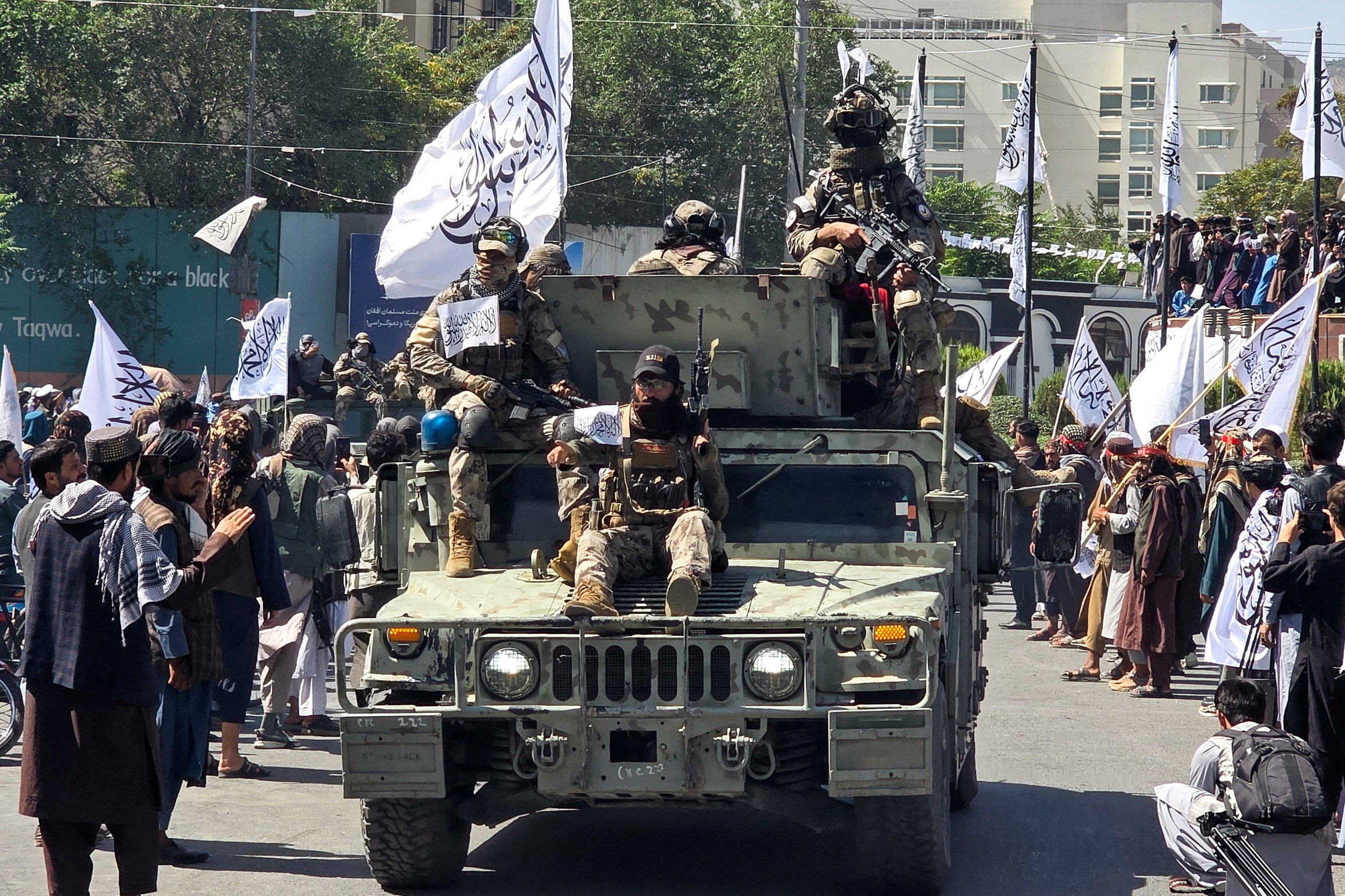 Taliban members attend a rally to mark five years in power, outside the former US embassy in Kabul, Afghanistan, August 15, 2026