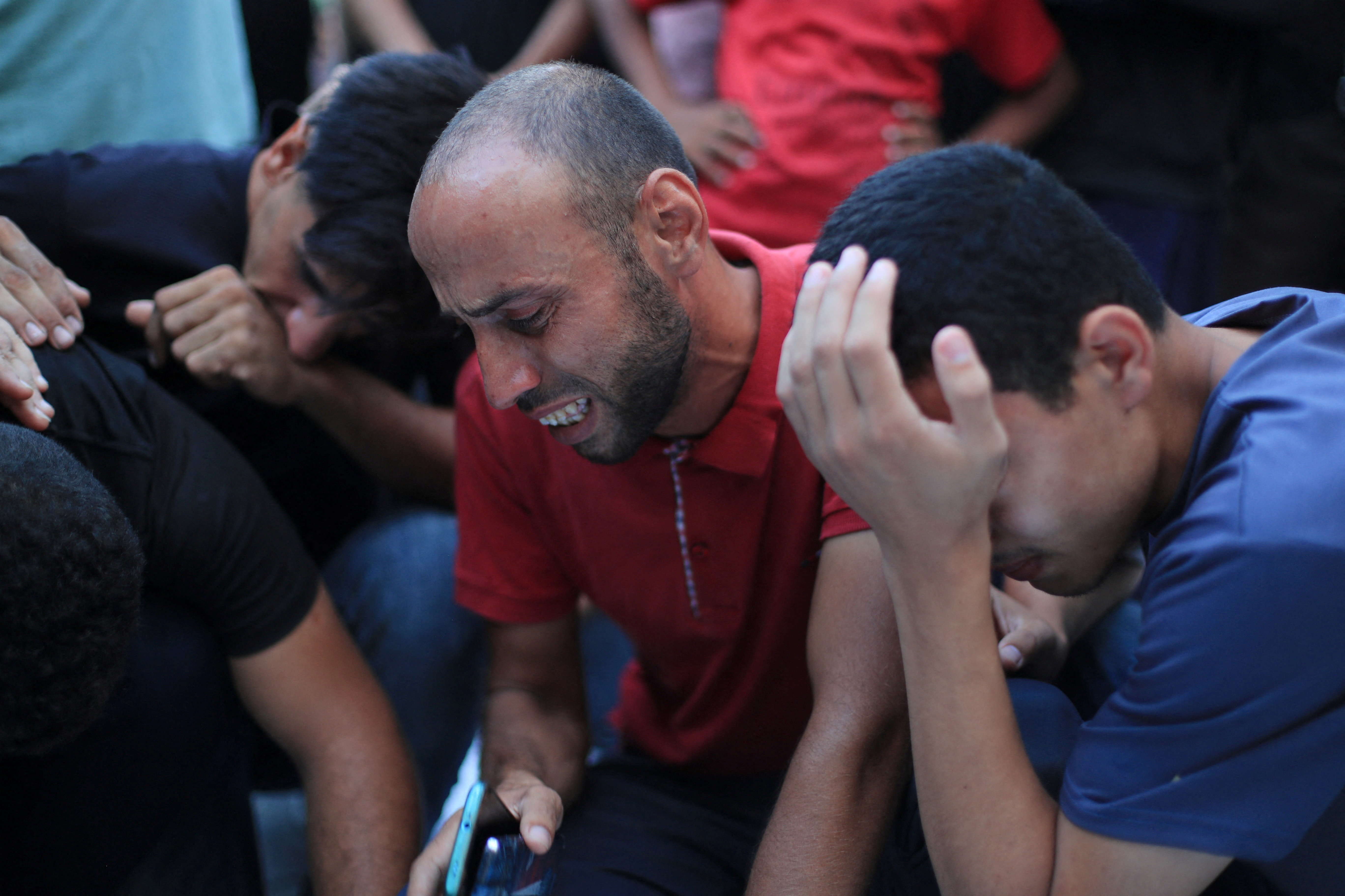 Mourners react after Palestinians were killed in an Israeli strike on a cafe, at Al-Shifa hospital in Gaza City August 18, 2026. REUTERS/Dawoud Abu Alkas