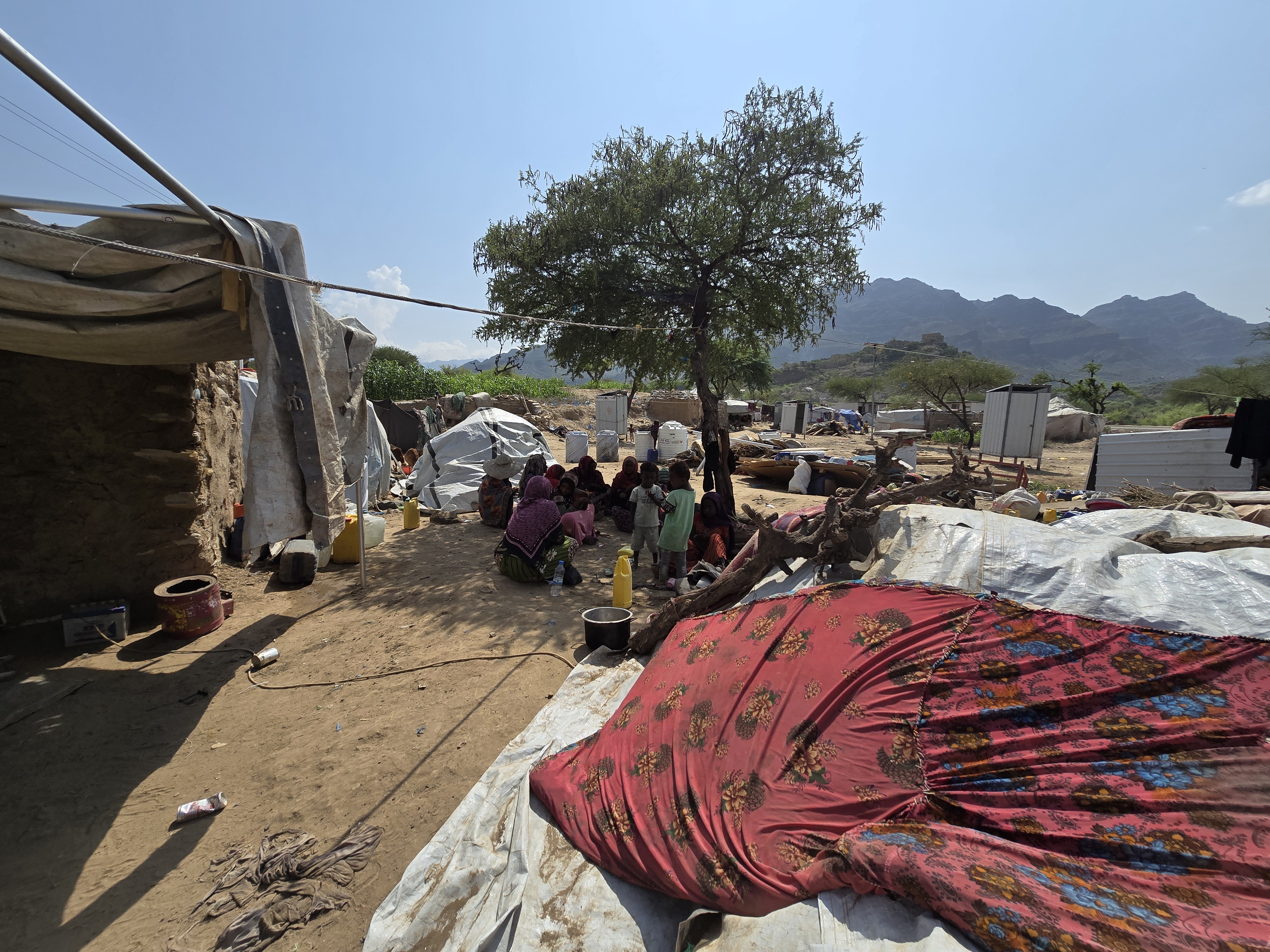 Aman and hundreds of displaced families are trying to set up new shelters, but they have received no support from humanitarian organizations [Khalid Al-Banna/Al Jazeera English]