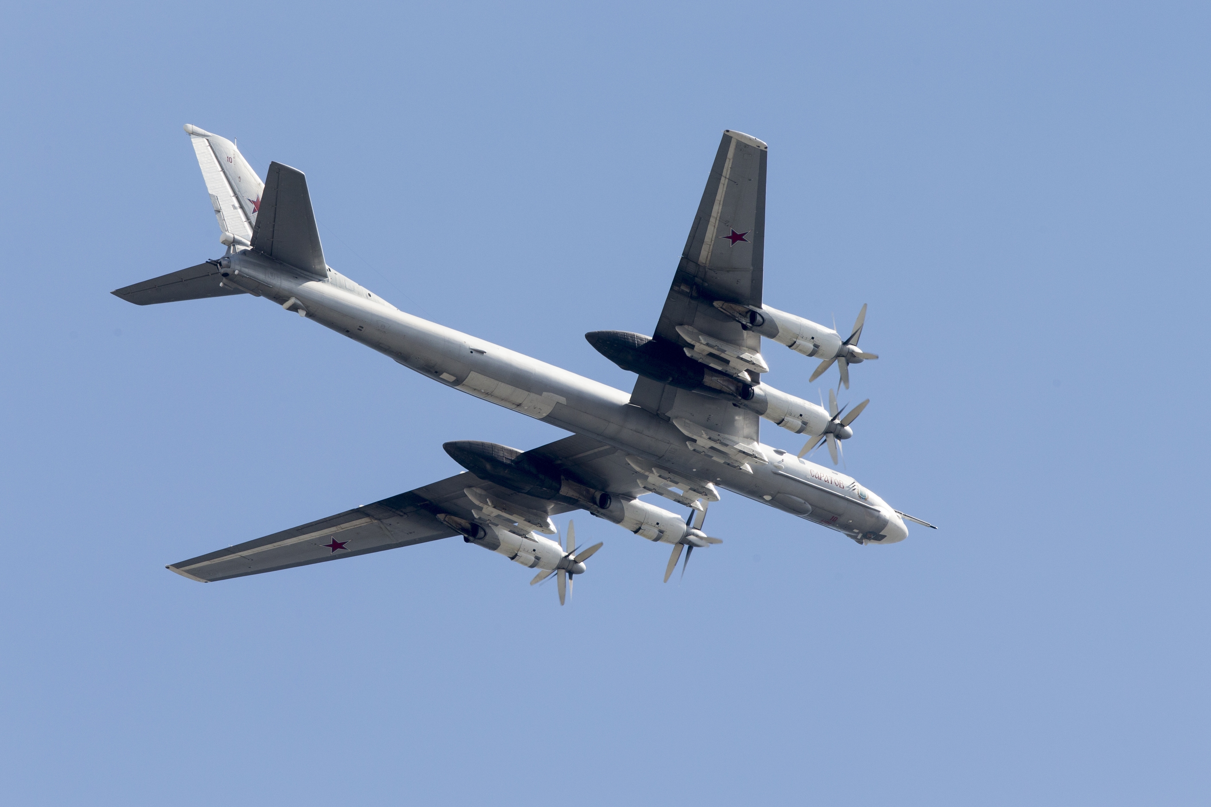 Russian the Tu-95 strategic bomber fly over Red Square during the general rehearsal for the Victory Day military parade
