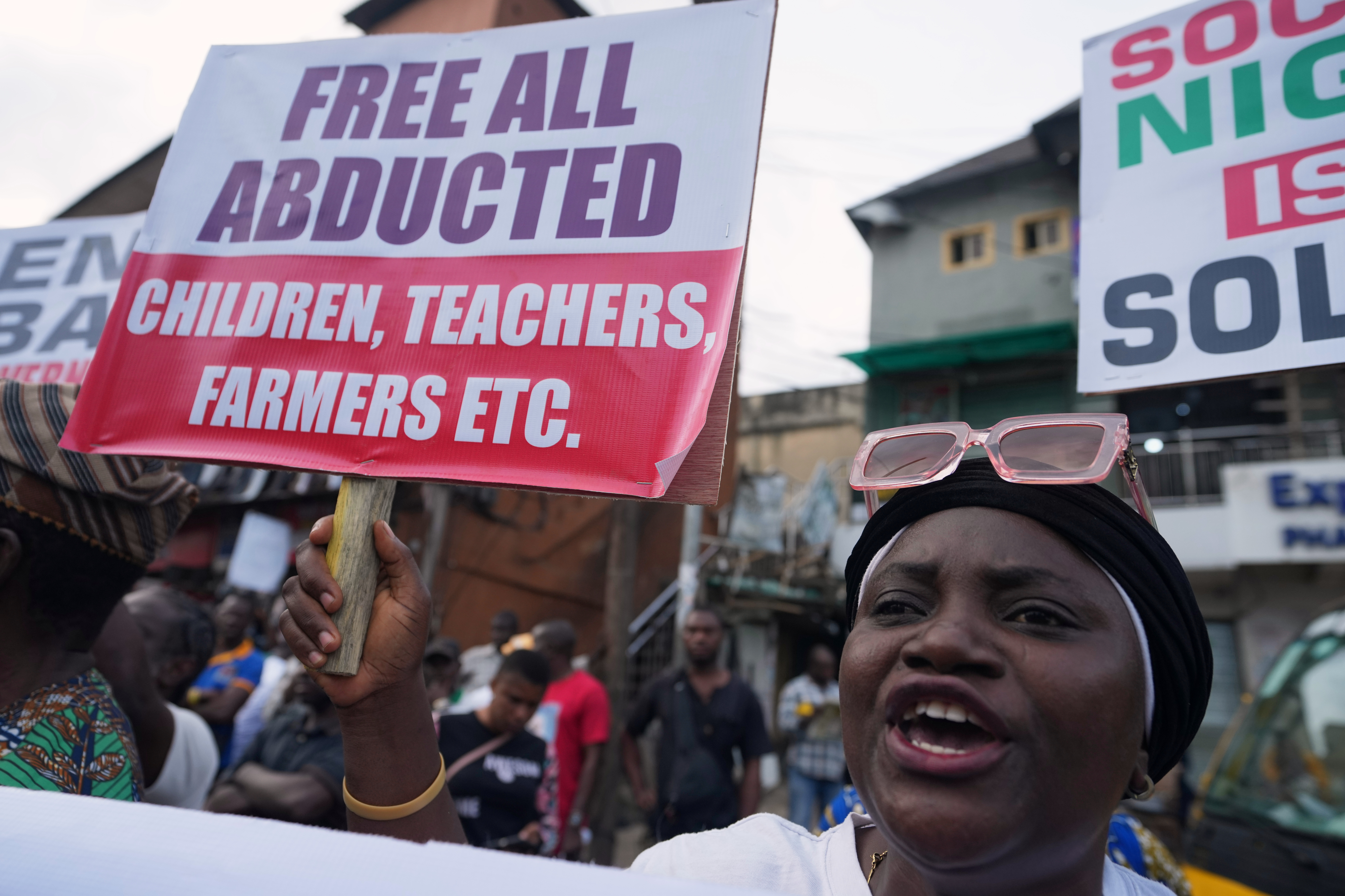 A woman protest demanding government to rescue the school children that were recently kidnapped in various part of the country, on the street of Lagos, Nigeria, Friday, June 12, 2026.