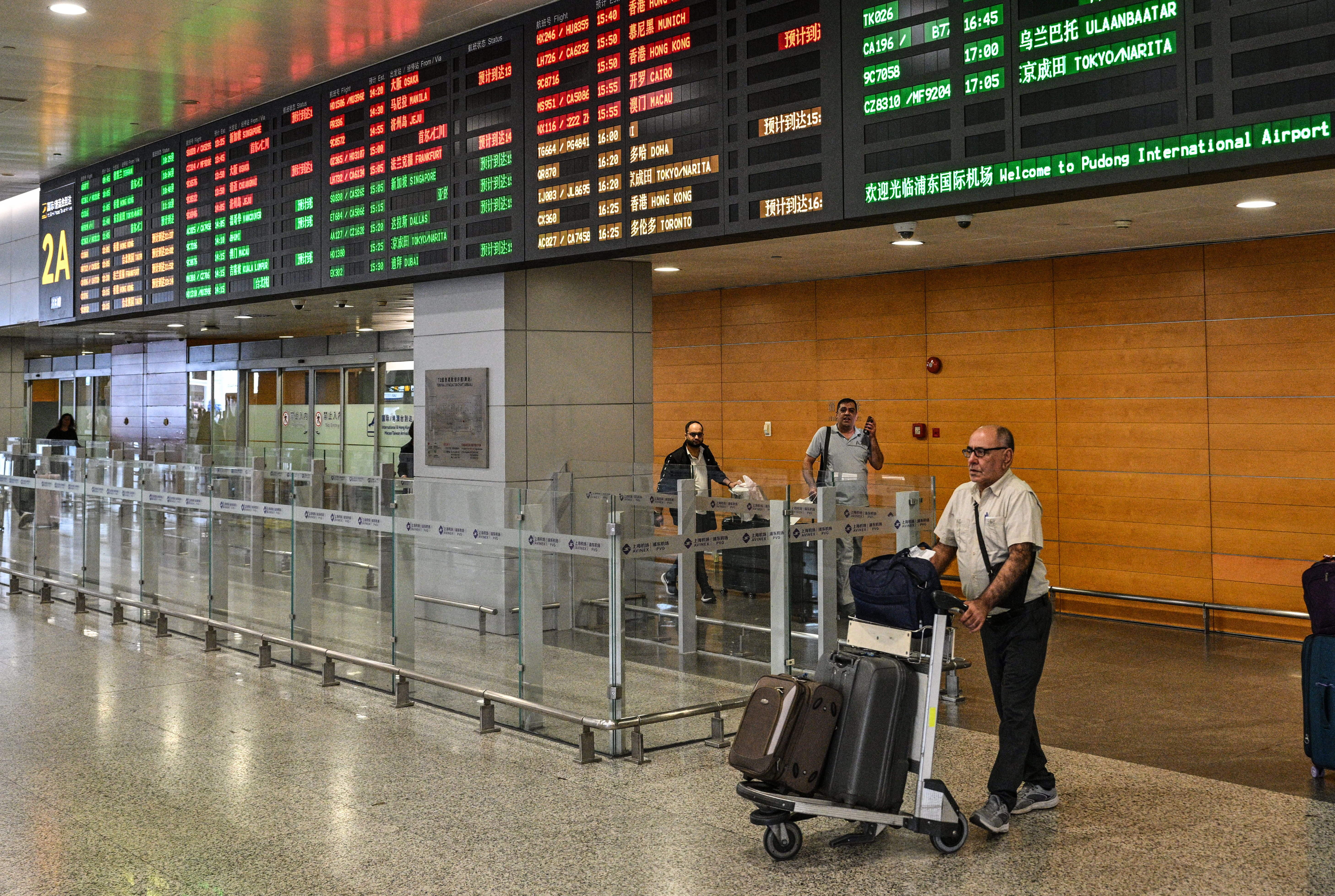 A man arriving from Tehran walks at Shanghai Pudong International Airport in Shanghai on September 24, 2026.