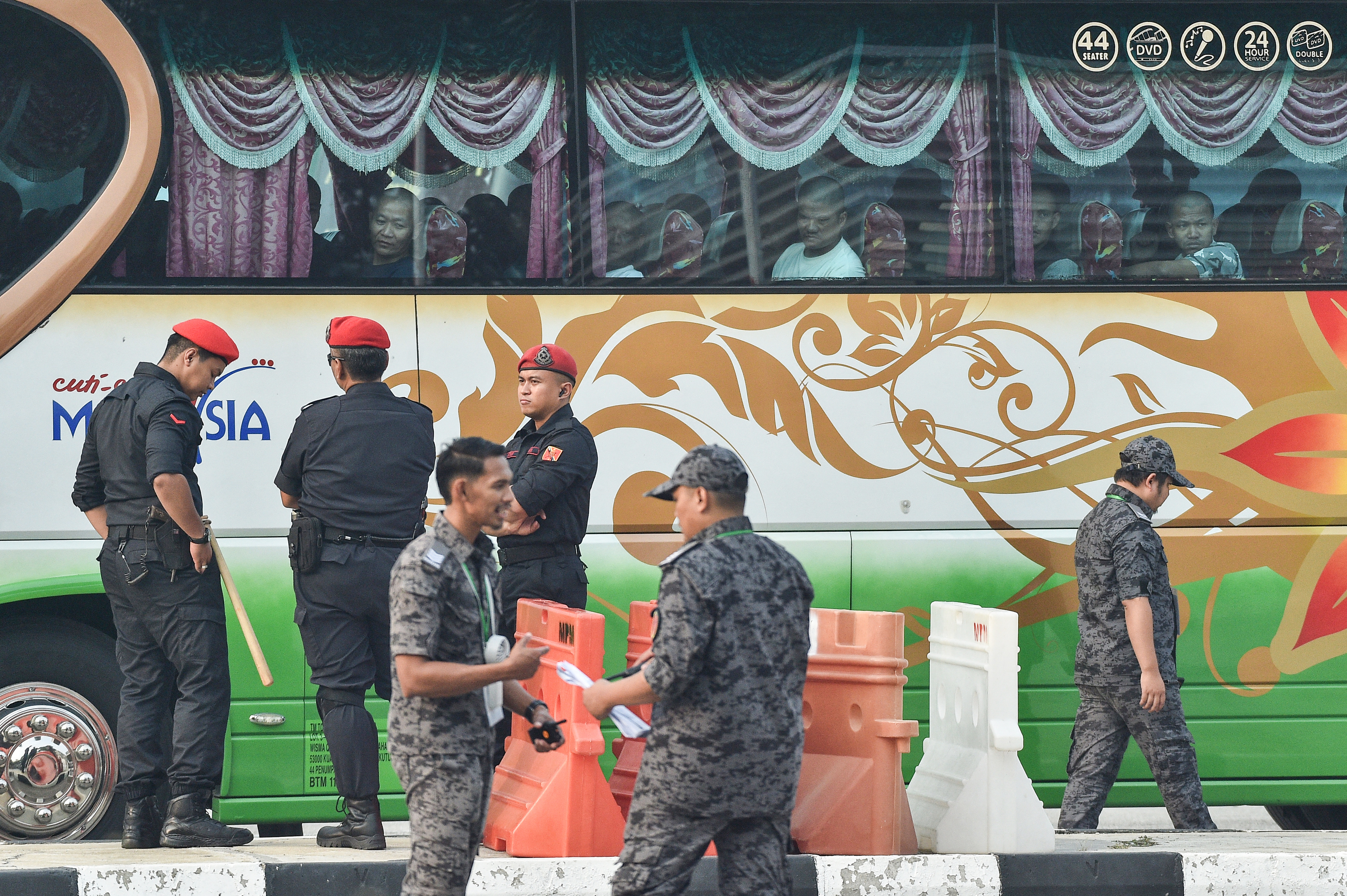 A bus carrying Myanmar nationals being repatriated from Malaysia is heading towards Lumut on the outskirts of Kuala Lumpur