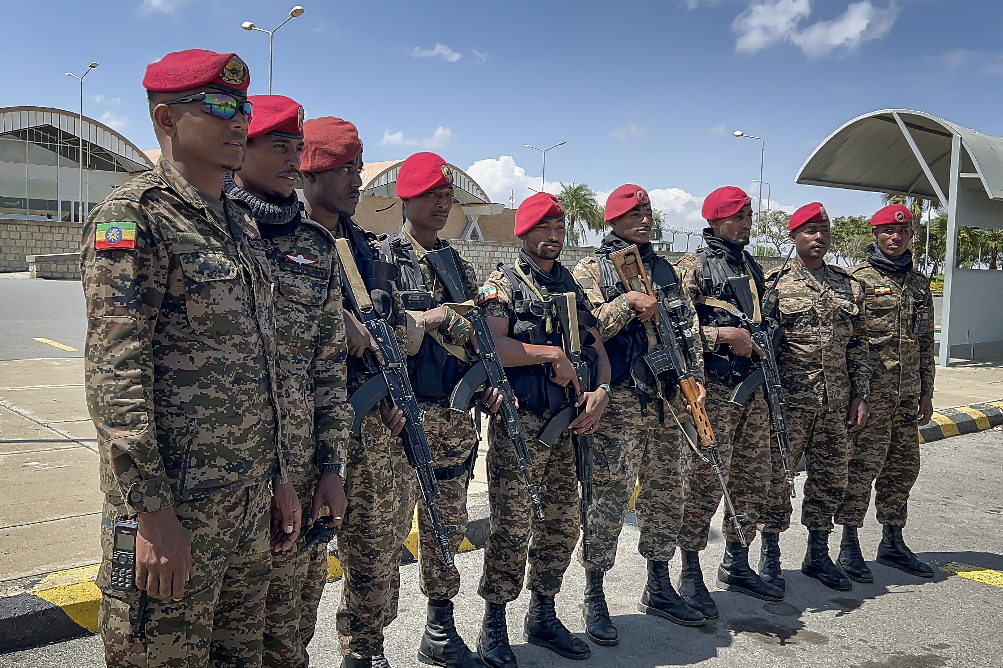 Members of the Ethiopian National Defense Force (ENDF) gather in front of Mekelle Alula Aba Nega International Airport after federal forces retook control of the facility in Mekelle, Ethiopia, October 6, 2026 [AFP]