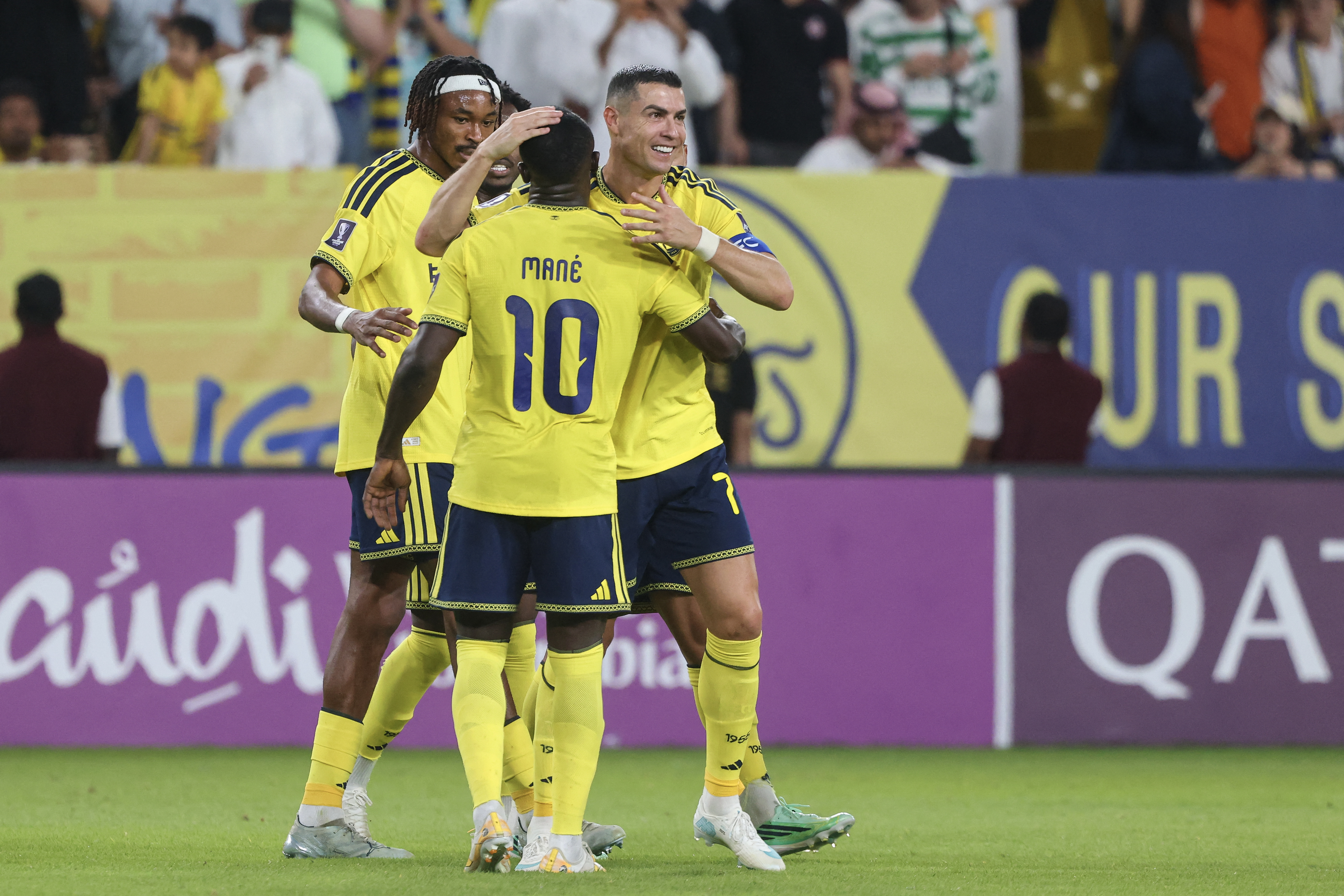 Nassr's Portuguese forward #07 Cristiano Ronaldo celebrates with Nassr's Senegalese Forward #10 Sadio Mane after scoring his team's second goal during the AFC Champions League group B football match between Al-Nassr and Neftchi Fergana at the Alawwal Park stadium in Riyadh on October 12, 2026. (Photo by Fayez NURELDINE / AFP)