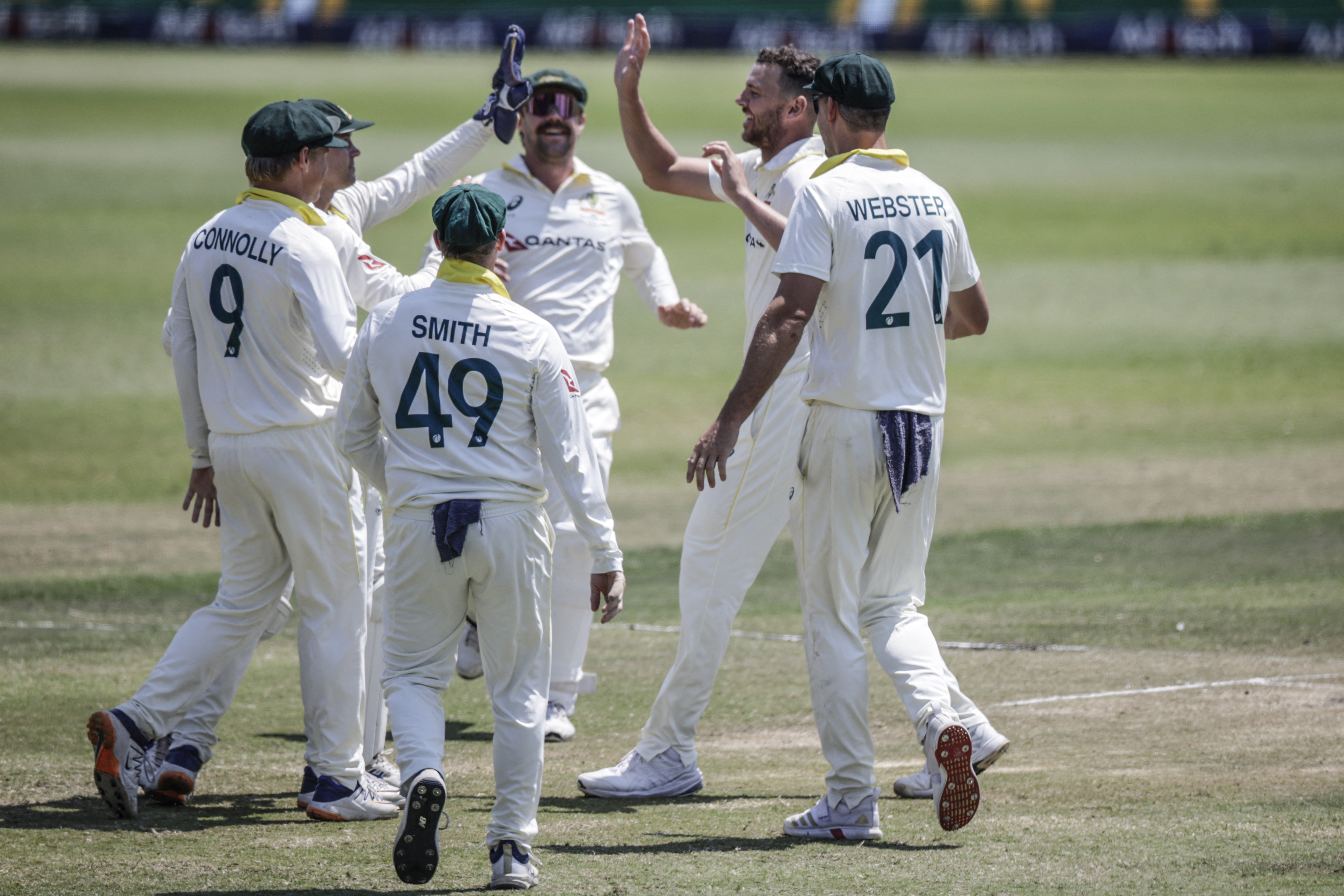 Australia's Josh Hazlewood (2nd R) celebrates with his teammates after dismissing South Africa's Wiaan Mulder on day five of the first Test match between South Africa and Australia at the Kingsmead stadium in Durban on October 13, 2026. (Photo by Marco Longari / AFP)