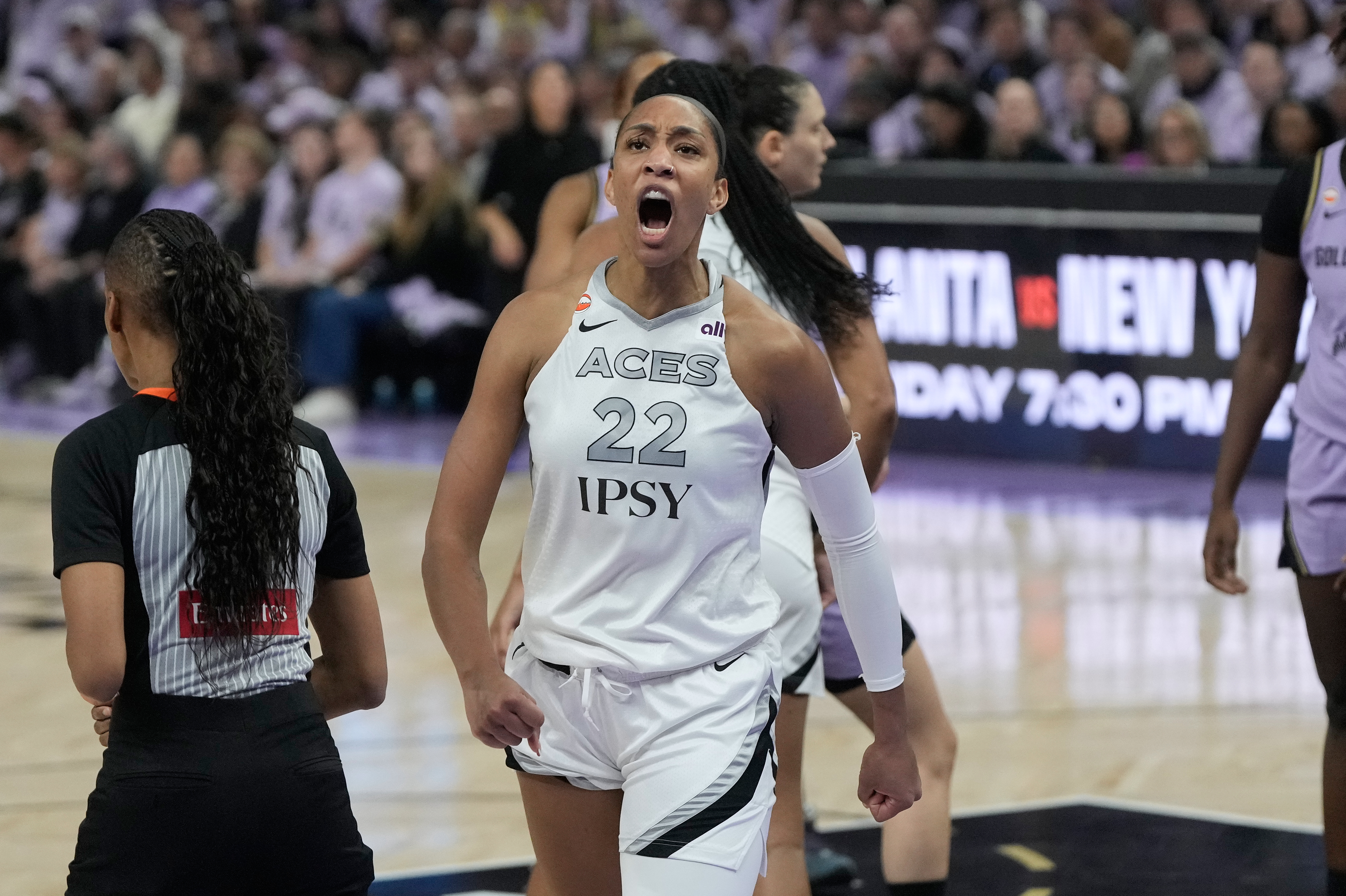 Las Vegas Aces center A'ja Wilson (22) reacts after scoring and drawing a foul during the second half of Game 2 of the WNBA basketball semifinals against the Golden State Valkyries on Wednesday