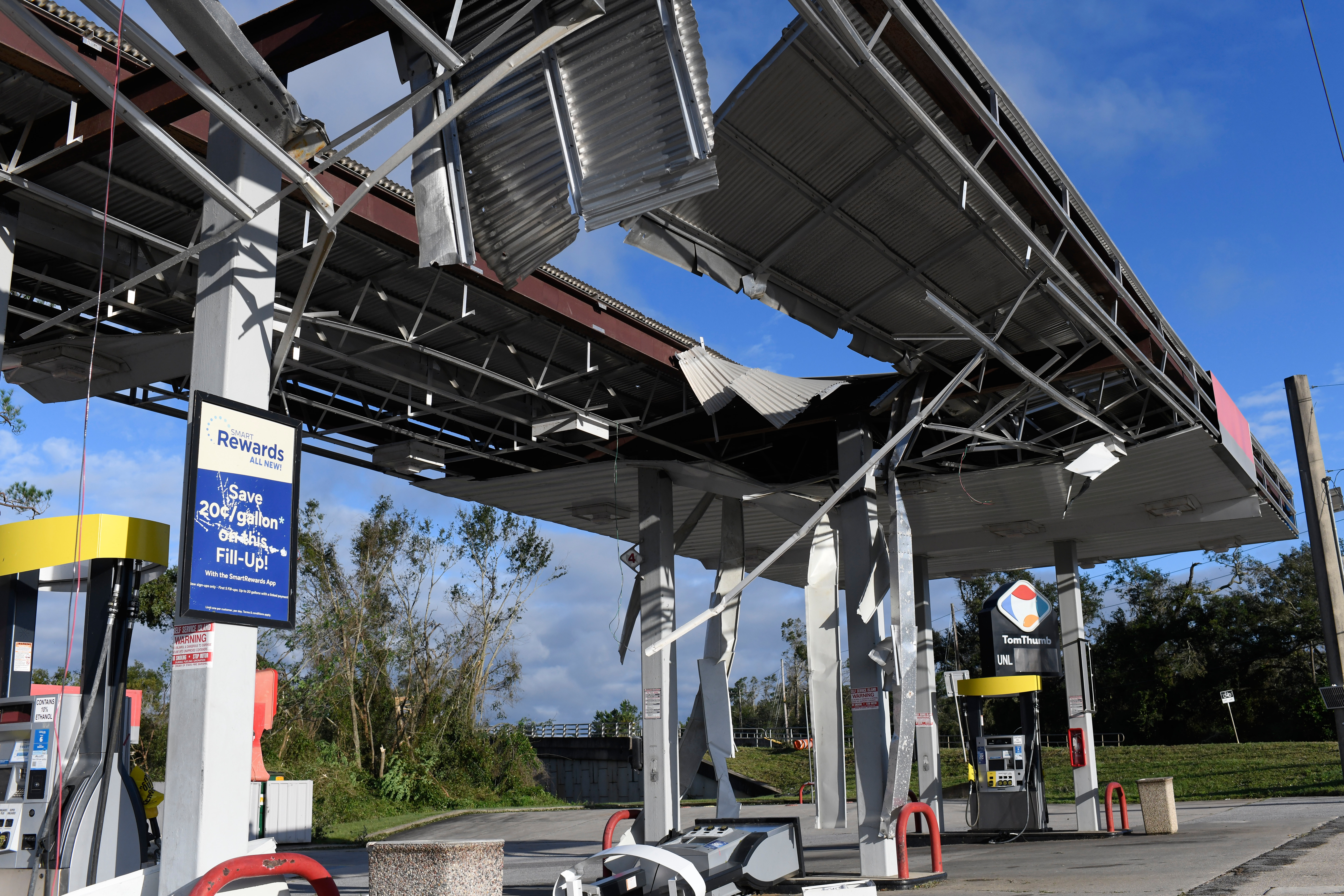 A gas station is damaged by the effects of Isaias on Saturday, Oct. 10, 2026, in East Milton, Fla. (AP Photo/Octavio Jones)