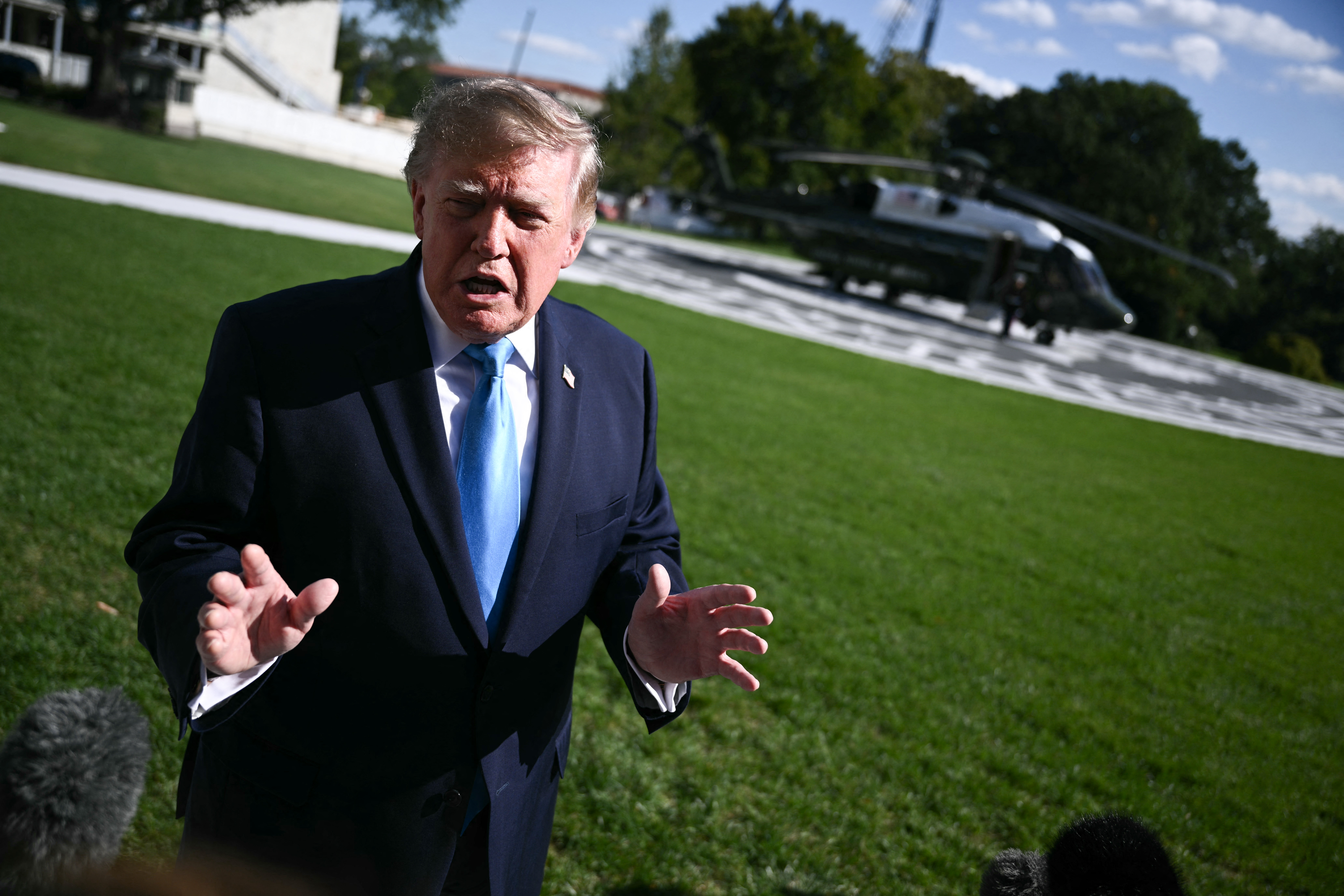 US President Donald Trump speaks to the press before departing from the South Lawn of the White House in Washington, DC, on October 5, 2026.