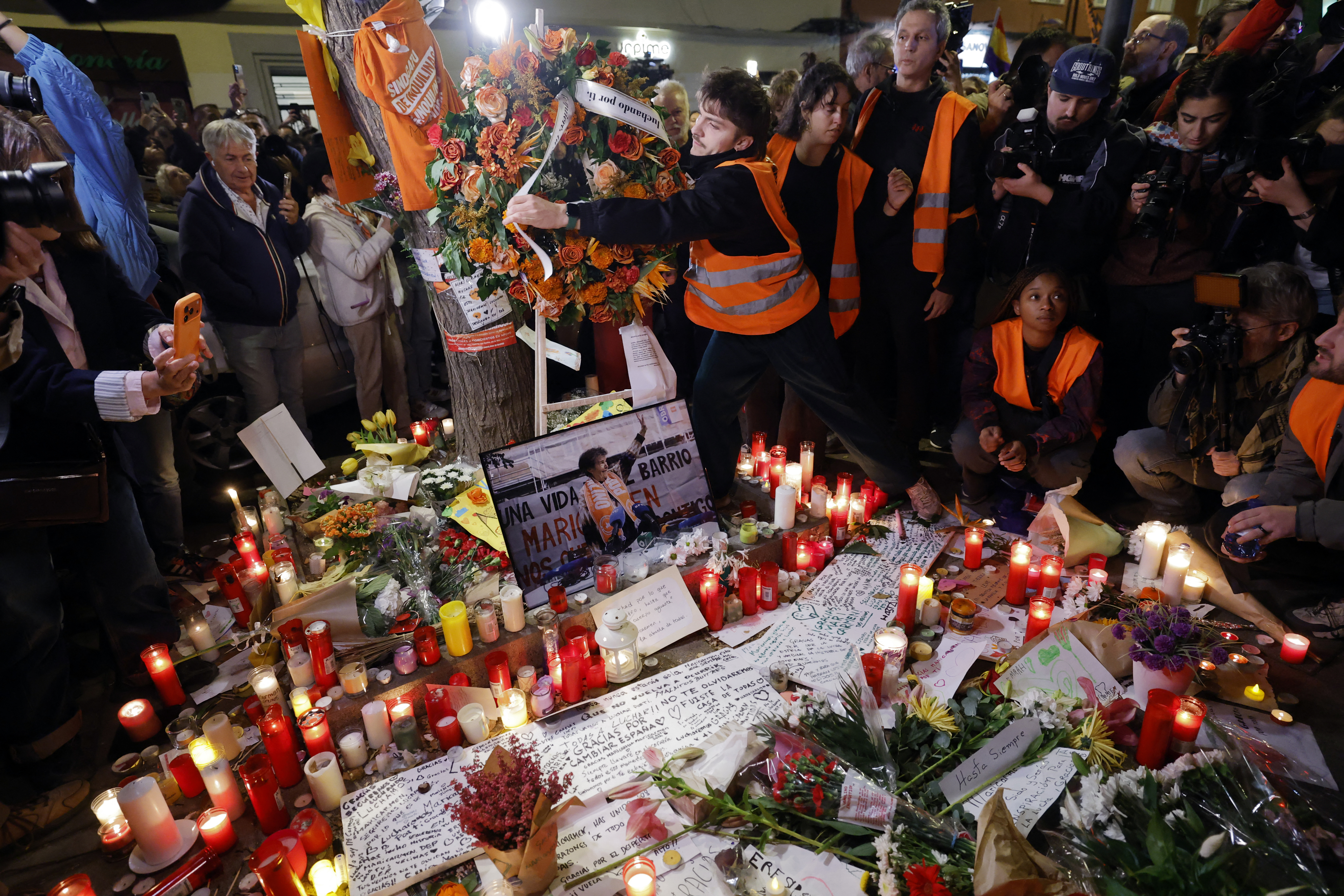 Protesters gather to pay tribute to Maricarmen Abascal in front of her apartment, the 87-year-old pensioner whose eviction triggered nationwide protests over Spain's chronic housing crisis and a political debate that culminated in early elections, during a demonstration in Madrid on October 8, 2026.