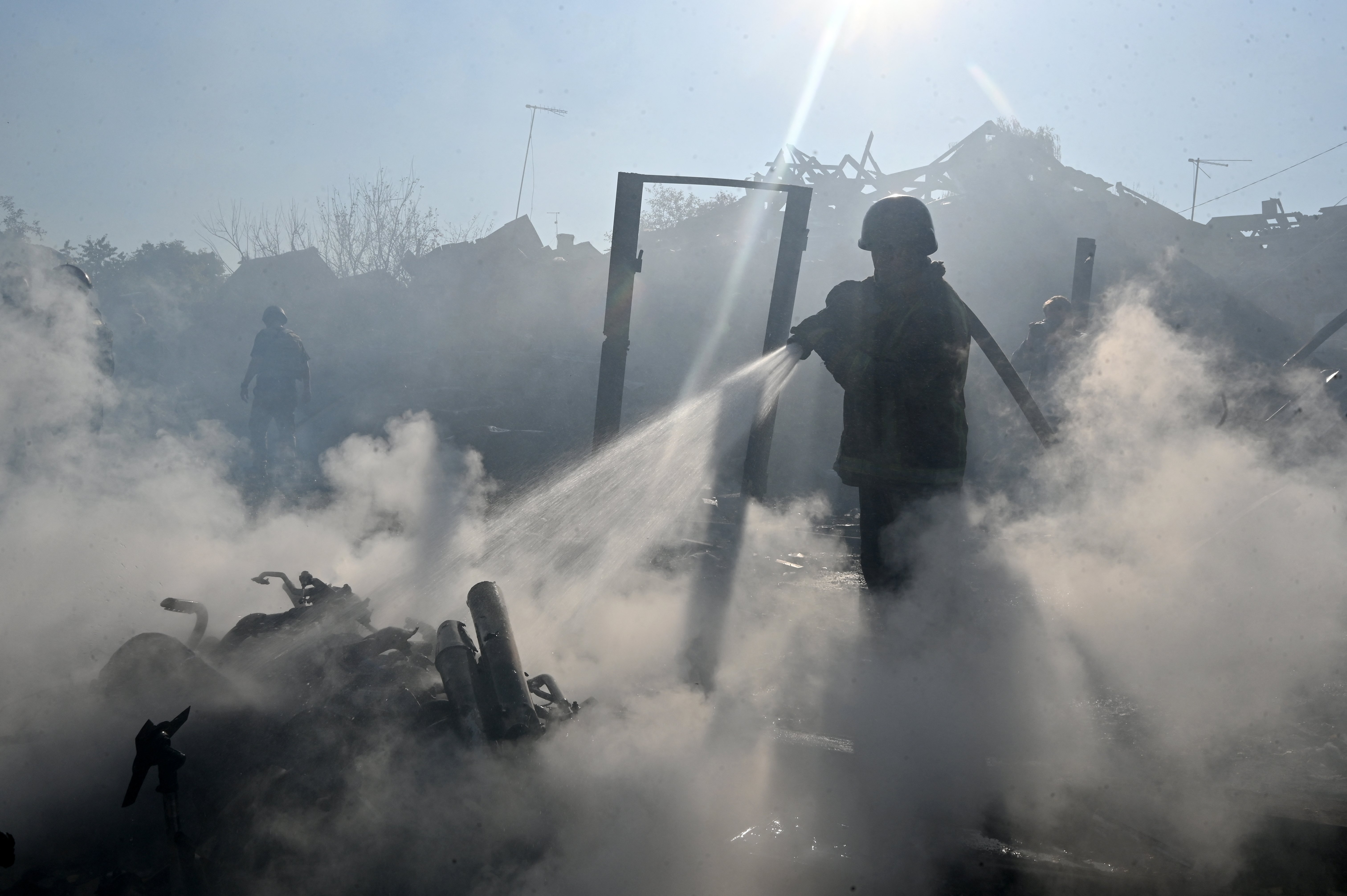 A firefighter extinguishes a fire in private houses following a Russian guided aerial bomb attack that killed one person, amid the Russian invasion of Ukraine, in Kharkiv on October 11, 2026.