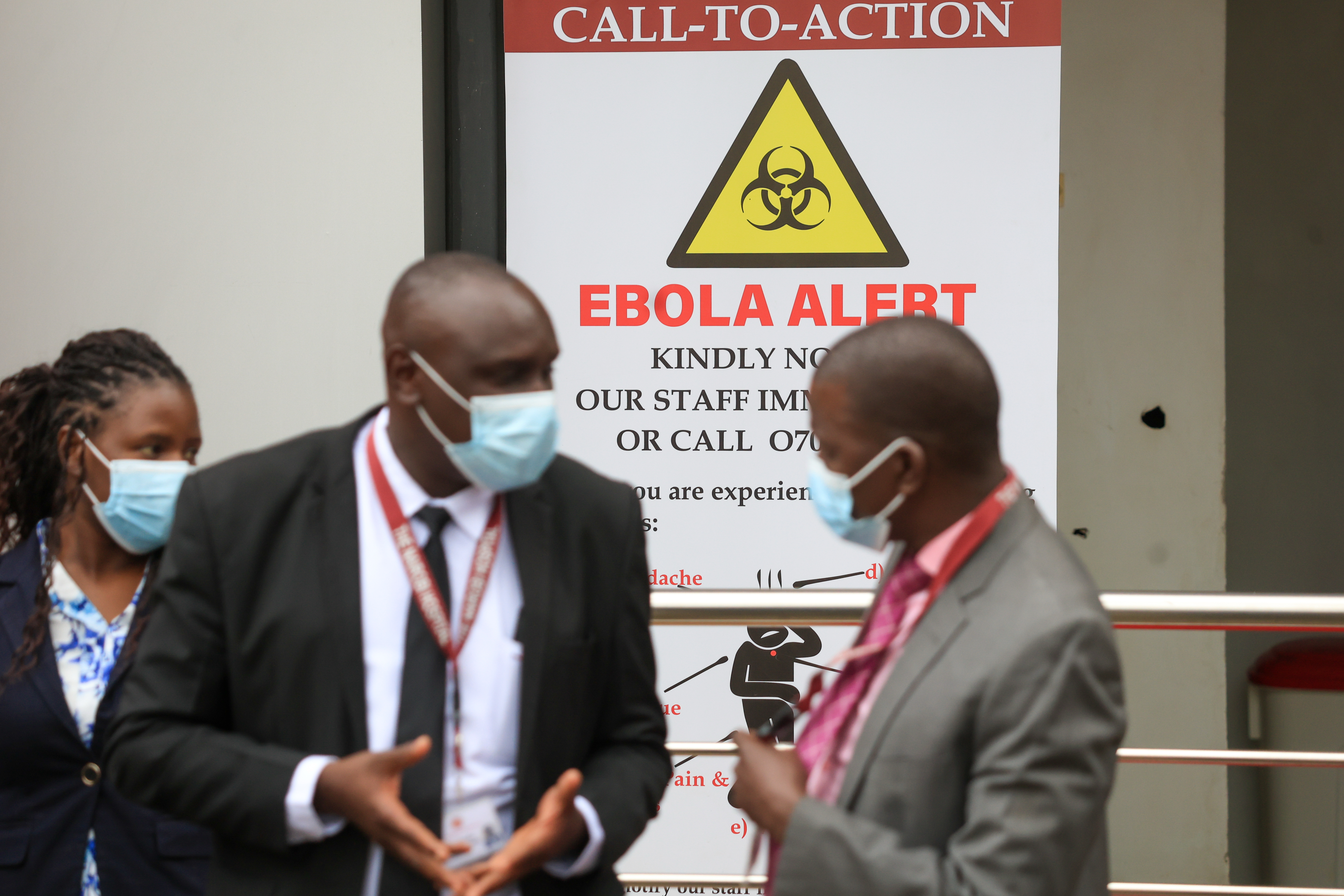 Health workers and officials stand outside a Ebola isolation facility at The Nairobi Hospital, Kenya, Wednesday, Oct. 7, 2026. (AP Photo/Andrew Kasuku)