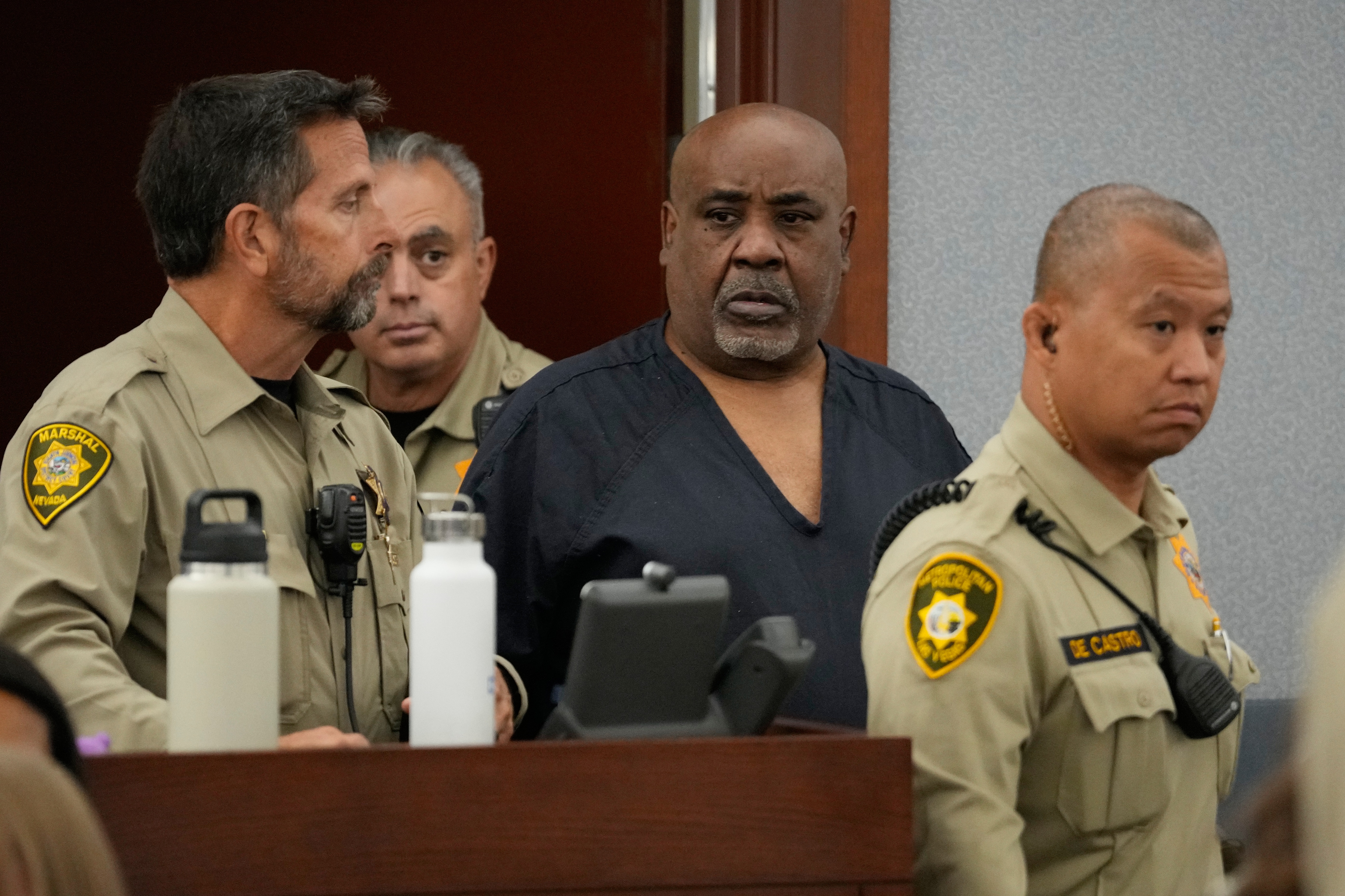 Duane Davis, center, arrives for a sentencing hearing after his murder conviction in the death of rapper Tupac Shakur on Tuesday, Oct. 13, 2026, in Las Vegas. (AP Photo/John Locher, Pool)