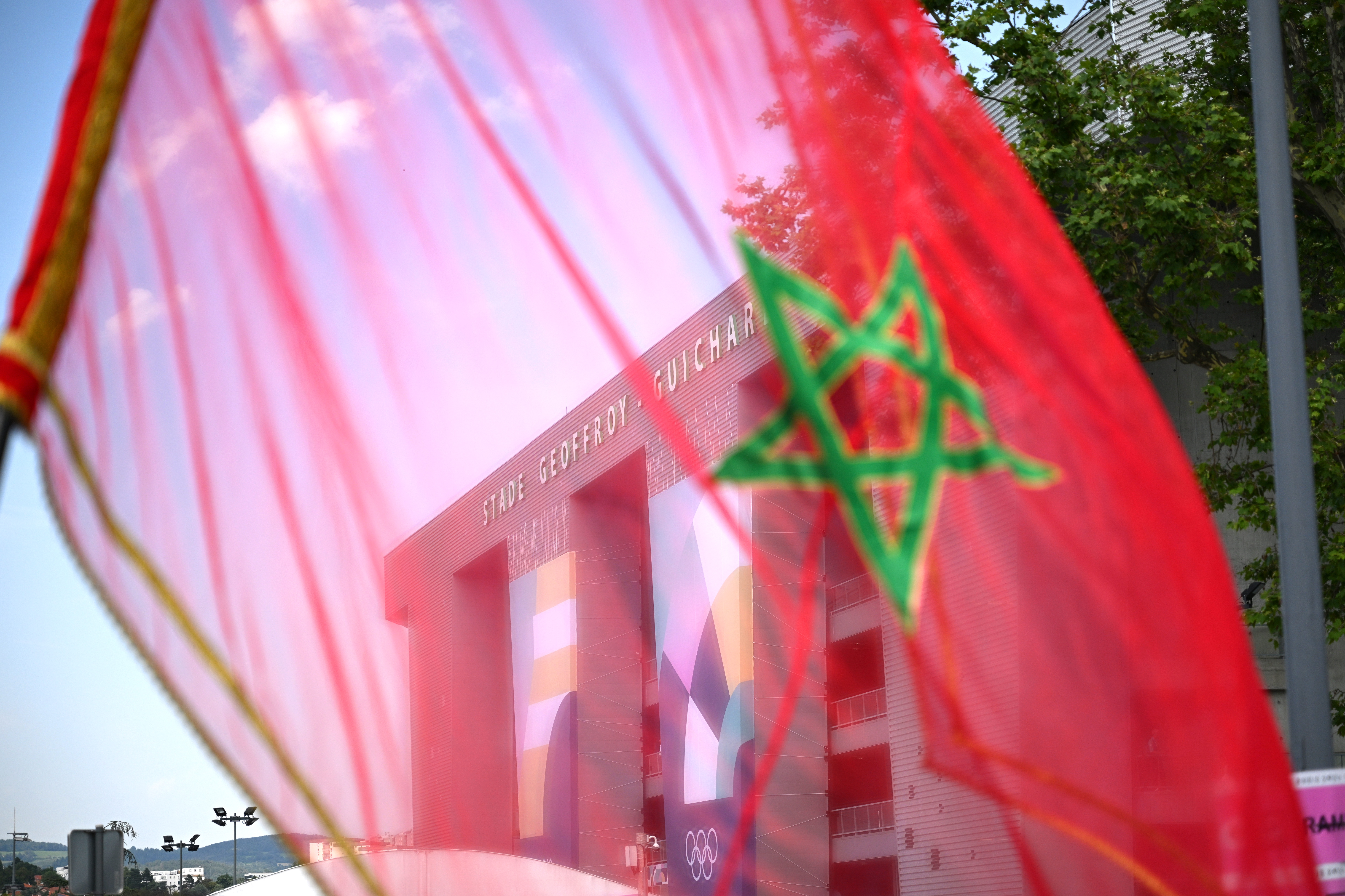 SAINT-ETIENNE, FRANCE - JULY 27: A general view of Morocco flags prior to the Men's group B match between Ukraine and Morocco during the Olympic Games Paris 2024 at Stade Geoffroy-Guichard on July 27, 2024 in Saint-Etienne, France. (Photo by Tullio M. Puglia/Getty Images)