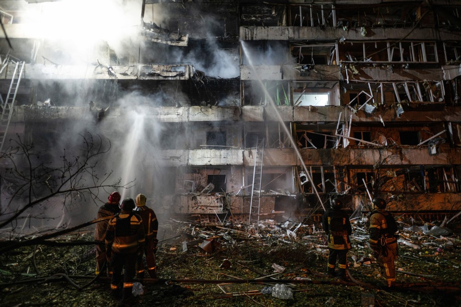 Ukrainian firefighters extinguish a blaze at the site of a Russian missile strike at an apartment building in Kyiv on October 14, 2026, amid the Russian invasion of Ukraine. [Photo by Genya SAVILOV / AFP]