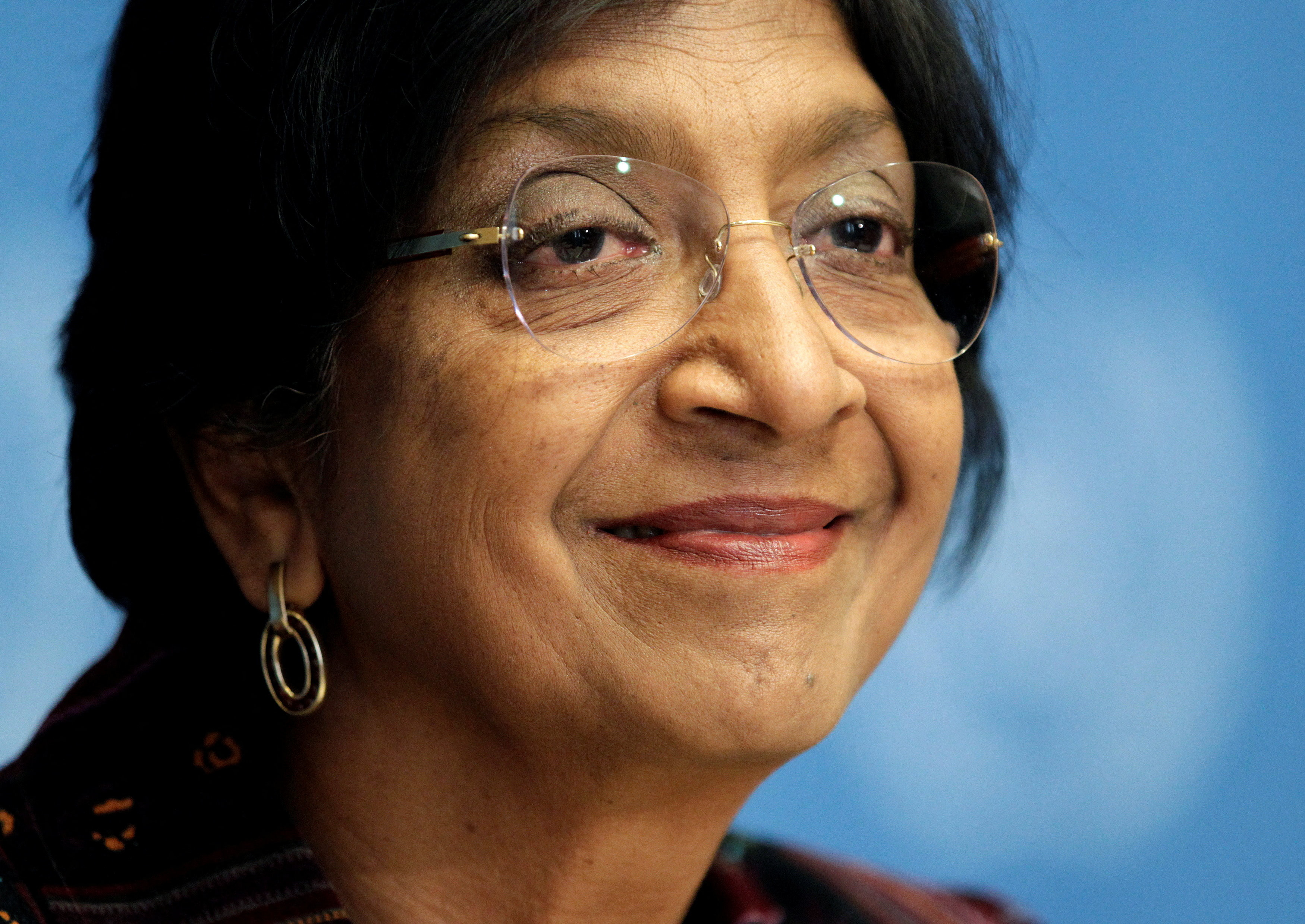 FILE PHOTO: U.N. High Commissioner for Human Rights Navi Pillay smiles during a news conference at the United Nations European headquarters in Geneva, Switzerland October 18, 2012. REUTERS/Denis Balibouse/File Photo