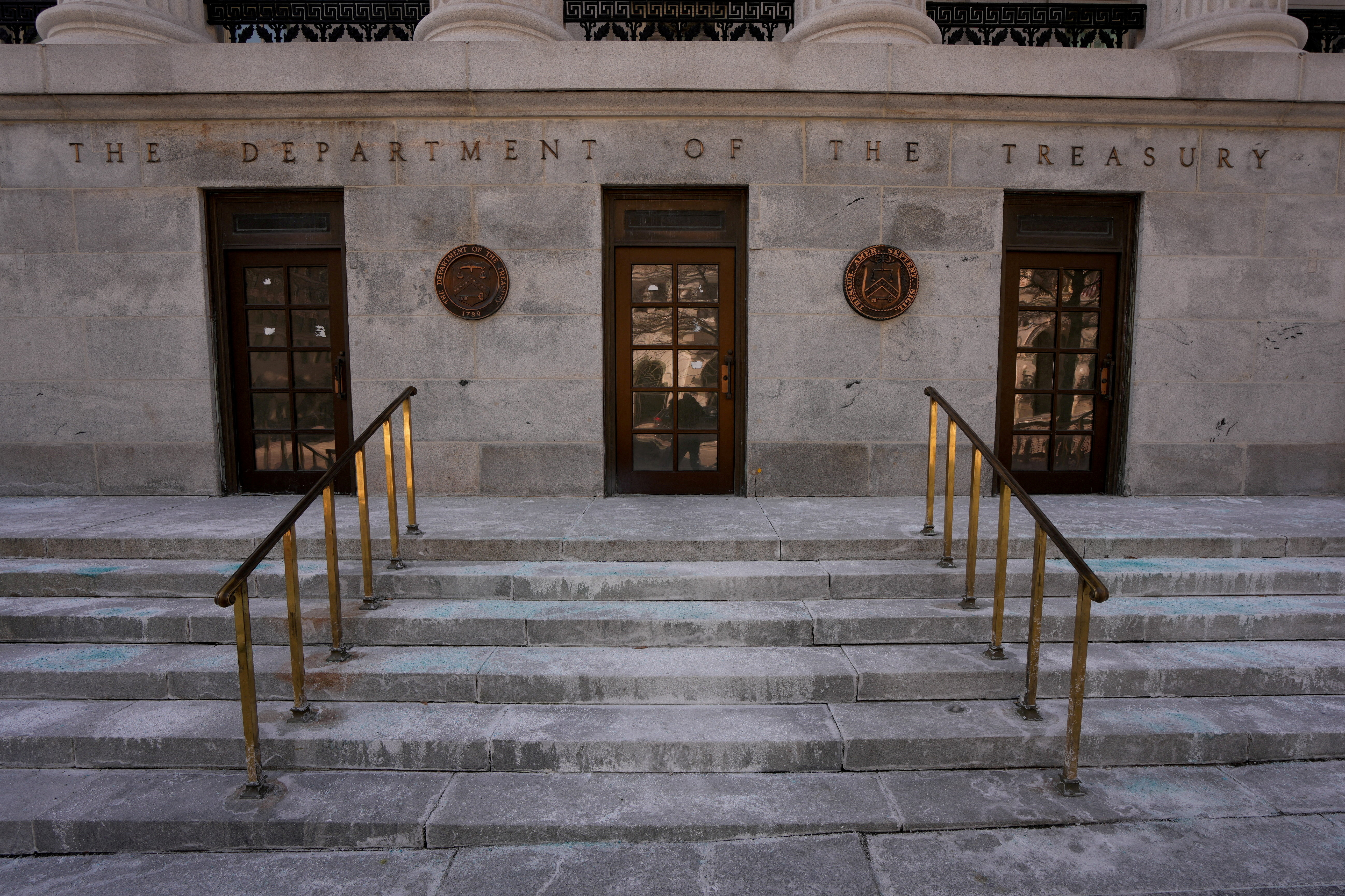 FILE PHOTO: A general view of the entrance to the U.S. Department Of The Treasury on day two of a partial government shutdown in Washington, D.C., U.S., February 1, 2026. REUTERS/Ken Cedeno/File Photo