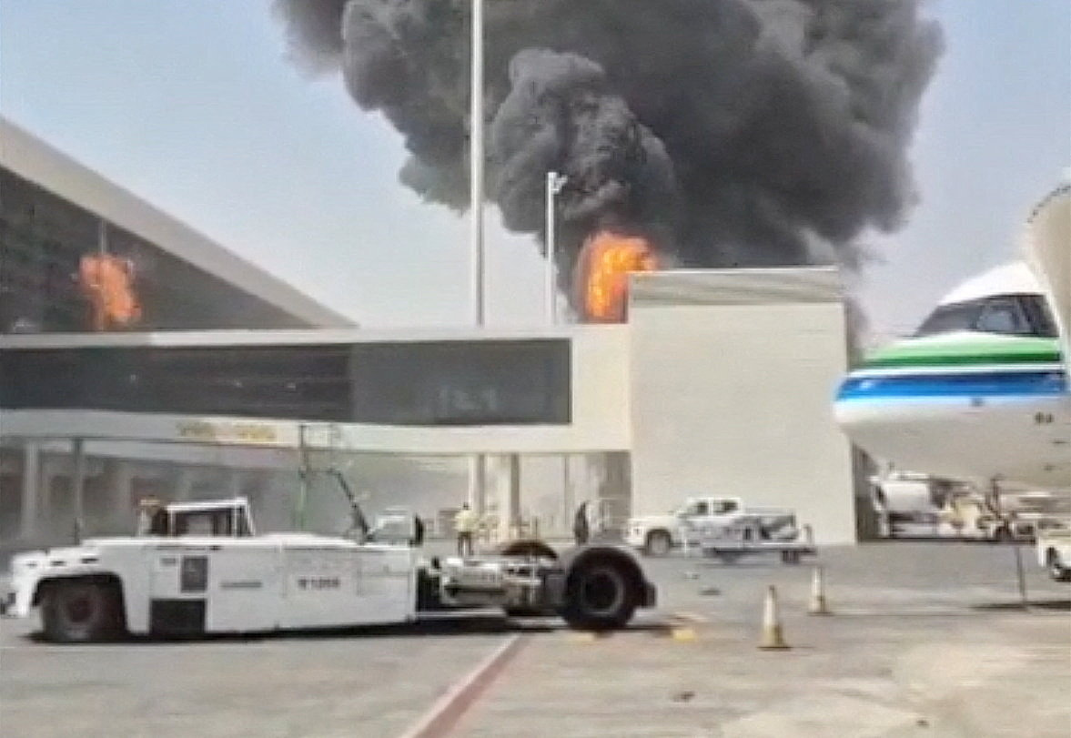 Smoke and flames rise from King Khalid Airport, after Yemen's Iran-backed Houthis said they attacked the airport, in Riyadh, Saudi Arabia, October 8, 2026, in this screengrab obtained from a social media video. Social Media/via REUTERS THIS IMAGE HAS BEEN SUPPLIED BY A THIRD PARTY. NO RESALES. NO ARCHIVES. NEWS USE ONLY. BEST QUALITY AVAILABLE. Verification lines: The location was verified as Riyadh, Saudi Arabia, from the airport buildings, light poles, and painted tarmac markings which matched satellite imagery. Coordinates: 24.952651844496998, 46.70783371105999 Smoke was seen rising from a stationary aircraft at Riyadh airport on Thursday, according to a witness and three people briefed on the matter. There was no immediate official confirmation from Saudi authorities on the reported incident. No versions of the video were found posted online before October 8.