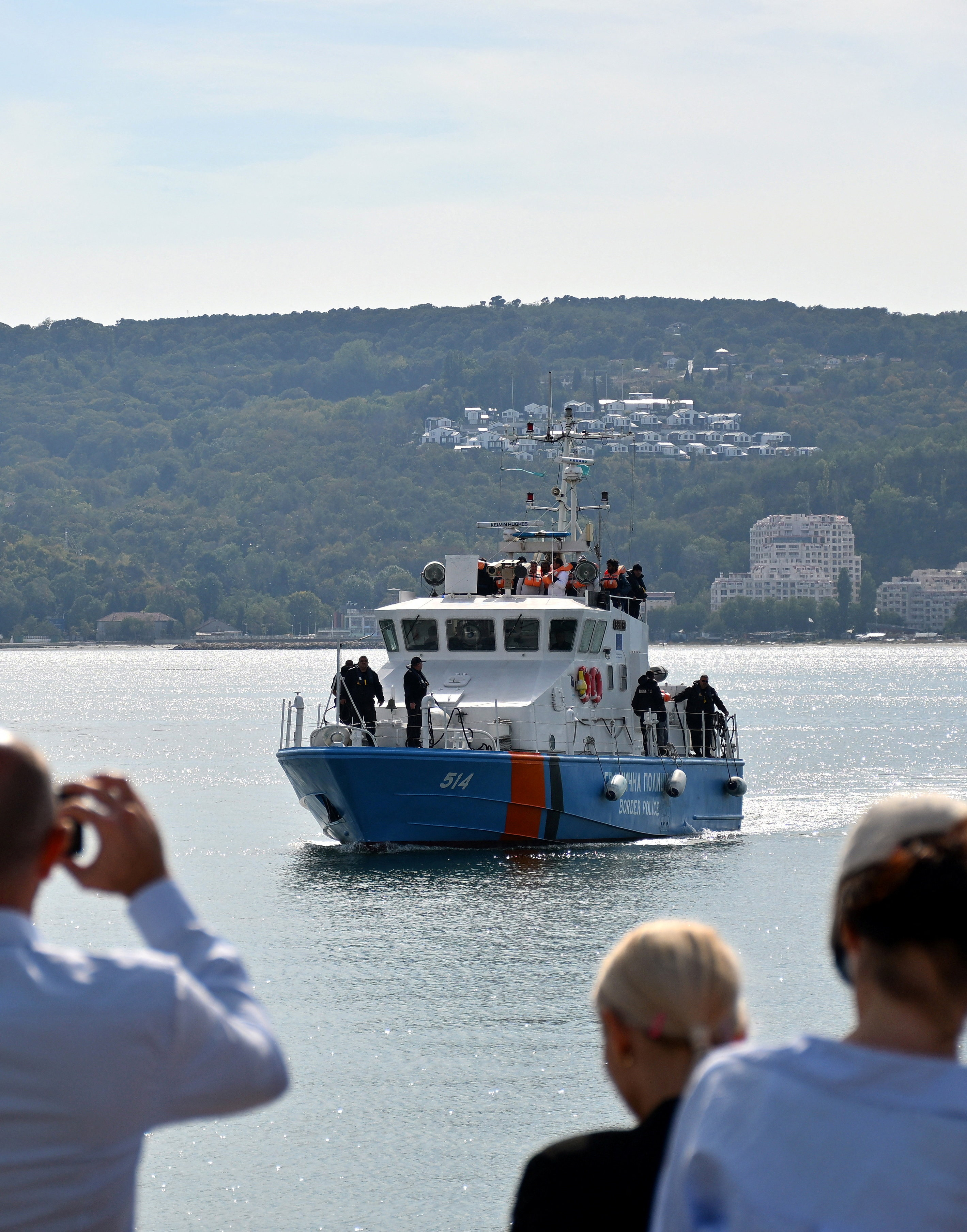 A Bulgarian border police vessel carrying crew members from a ship damaged in a drone attack, in Varna