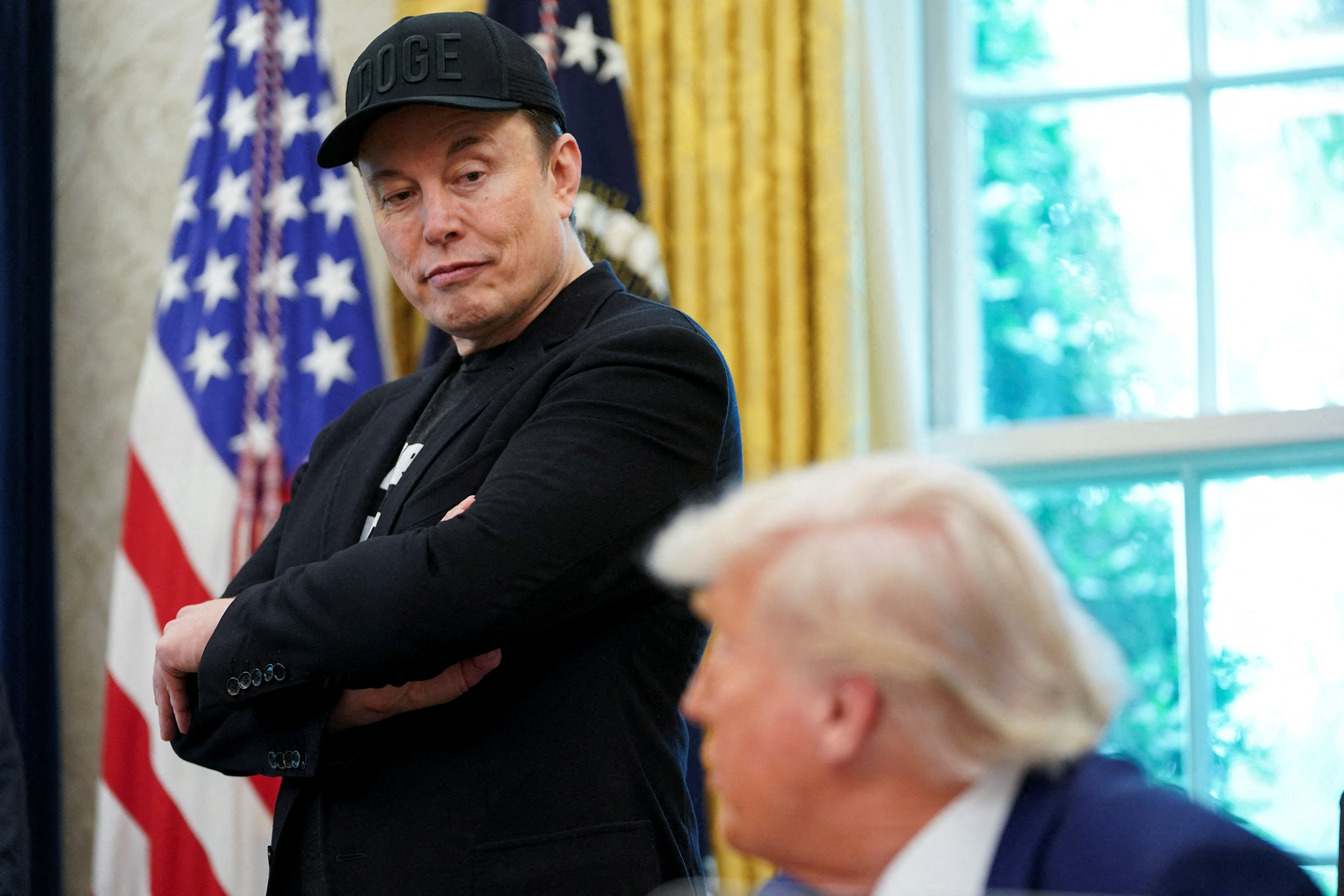 FILE PHOTO: U.S. President Donald Trump and Elon Musk attend a press conference in the Oval Office of the White House in Washington, D.C., U.S., May 30, 2025. REUTERS/Nathan Howard/File Photo